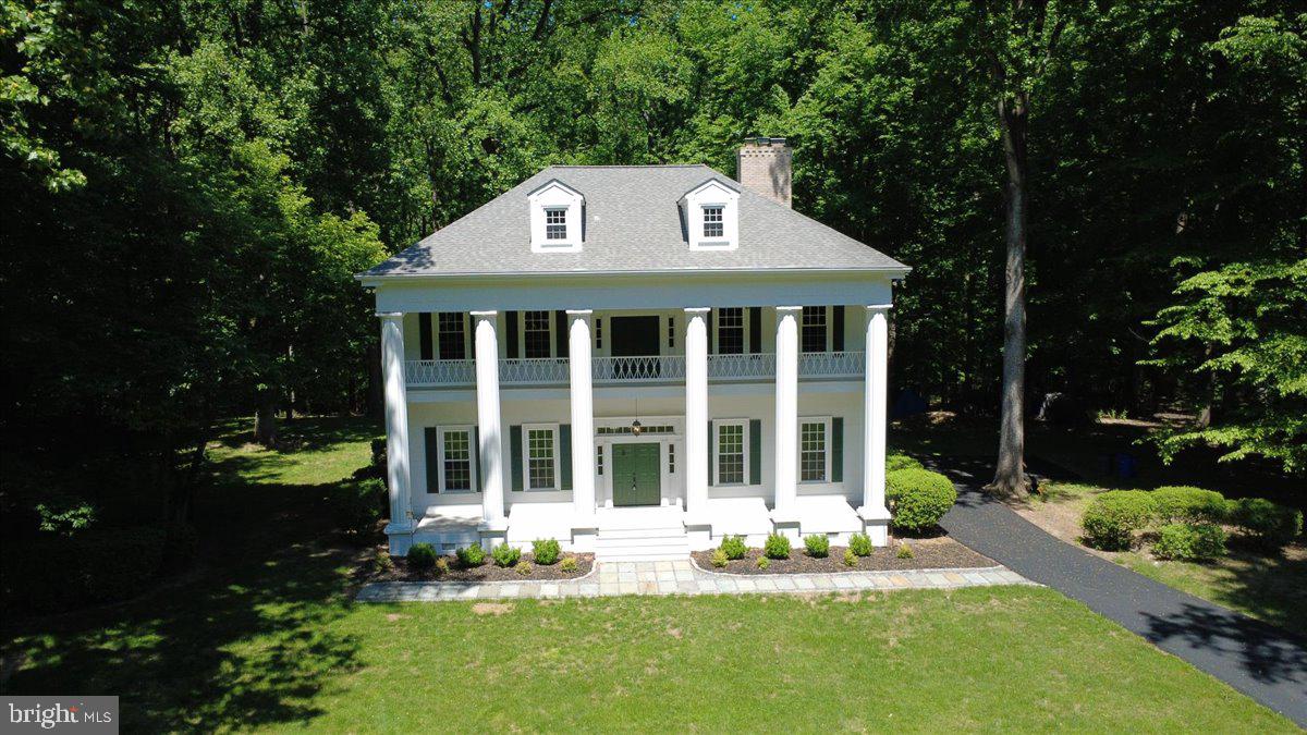 Don’t miss your chance to see this truly exceptional home! Nestled on a peaceful 3-acre lot in the sought-after Simpson Woods subdivision, this stunning property offers everything you could ask for. Picture yourself enjoying tranquil mornings on the inviting front porch or cozy evenings by one of three fireplaces—or the woodstove! With soaring 12-foot ceilings, spacious rooms, unique passageways between rooms, wide-plank hardwood floors, and over 4,100 square feet of beautifully finished living space across three levels, this home is nothing short of impressive.

The designer bathrooms—three full and one half—were completely remodeled within the past year and are absolutely breathtaking. The kitchen has also been refreshed with brand-new quartz countertops, LVP floor tiles, a modern faucet, and recessed lighting. The entire home has been freshly painted in elegant neutral tones, creating a warm and welcoming atmosphere.

This home features an array of thoughtful updates, including a new roof (2022), resurfaced driveway (2026), a new slate walkway and front landscaping (2026), new windows (2017), and updated kitchen appliances (all within the last 5 years). The front porch decking and soffits were replaced in 2025 and 2026, respectively. The third level was finished in 2025, adding 800 square feet of living space, complete with a bedroom, full bath, and family room. Plus, the three-zoned HVAC system ensures year-round comfort, with the attic and left-side units replaced just 3 months ago and the right-side unit upgraded within the past 4 years.

Be sure to explore the interactive floor plan to envision how this home could perfectly suit your lifestyle. Homes like this don’t come around often—schedule your showing today!