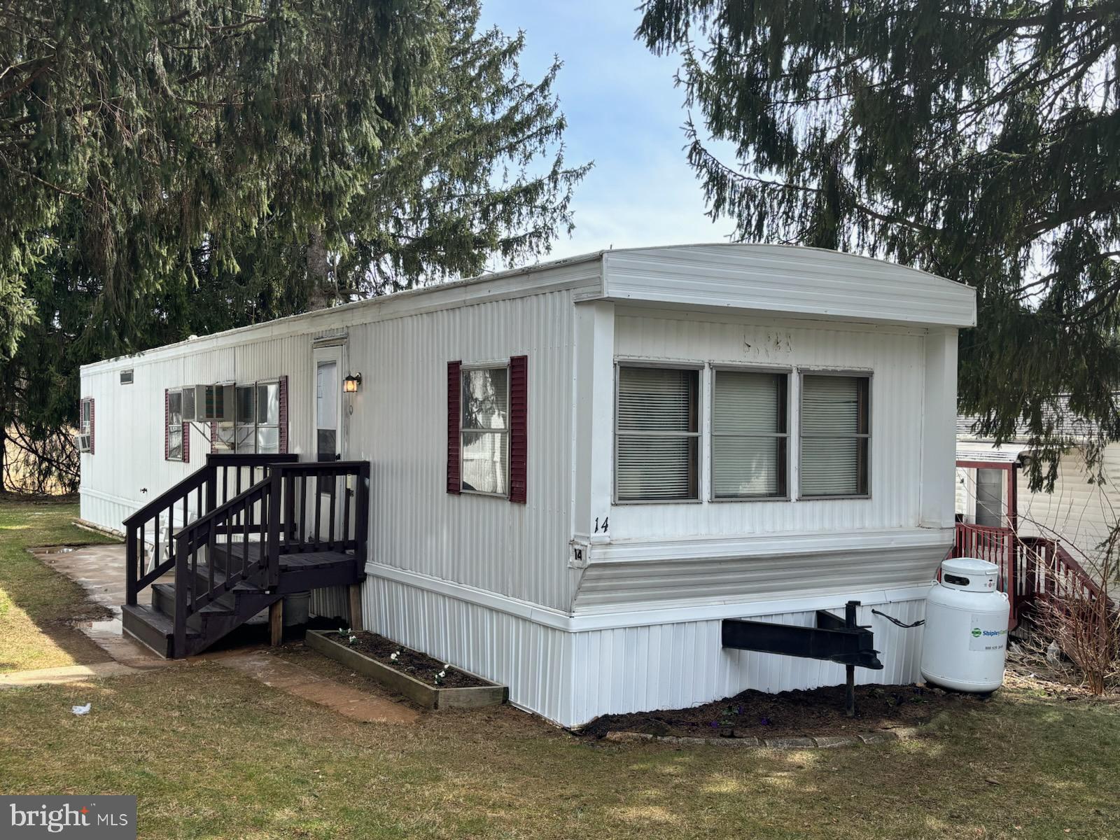 Pre-1976 mobile home is looking for its new owner! This mobile home is located in Park#1 of the quiet Hillandale Homes.  It offers 2 bedrooms, 1 bath, new washer and dryer, new refrigerator and small stand-alone freezer in unit. This property is part of an estate sale and is being sold as-is.  Buyers are welcome to conduct an inspection, however, no further repairs will be made by the sellers. The unit can be purchased with the furniture – which includes a nice kitchen set, two televisions, sofa and bedroom set.  The kitchen is equipped with a gas stove.  The unit is heated by propane and is only approximately $100 per month. The mobile home was recently power washed.  All park residents are subject to the approval of property management. Property has ground rent of $705 monthly and adjusts yearly. Ground rent includes water, sewer, trash removal 2x's a week and snow removal of the common areas. Residents are responsible for their own yard, ground and property maintenance.
