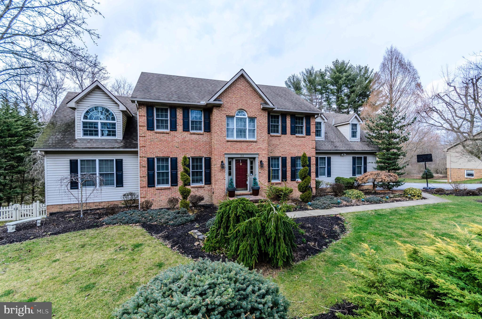 Beautiful custom built home on large open .89 acre of land! Large 22x13 deck overlooks the huge exquisitely landscaped backyard with a small flowing stream!  The walkout rec room offers easy access to secluded patio, small fish pond, and backyard secured with  large attract almond vinyl fencing.  This beautiful property is well off the beaten path nestled in a quiet setting.  You will enjoy the fine interior amenities dressed with all the trimmings:  built-ins, crown molding, wainscoting, chair railing, solid cherry kitchen cabinetry, and a stately mantled fireplace in large family room!  Absolutely amazing master bedroom suite including a very large 24x12 sitting room/office!  This beautiful property in Dallastown School District is a rare find in a rare location!