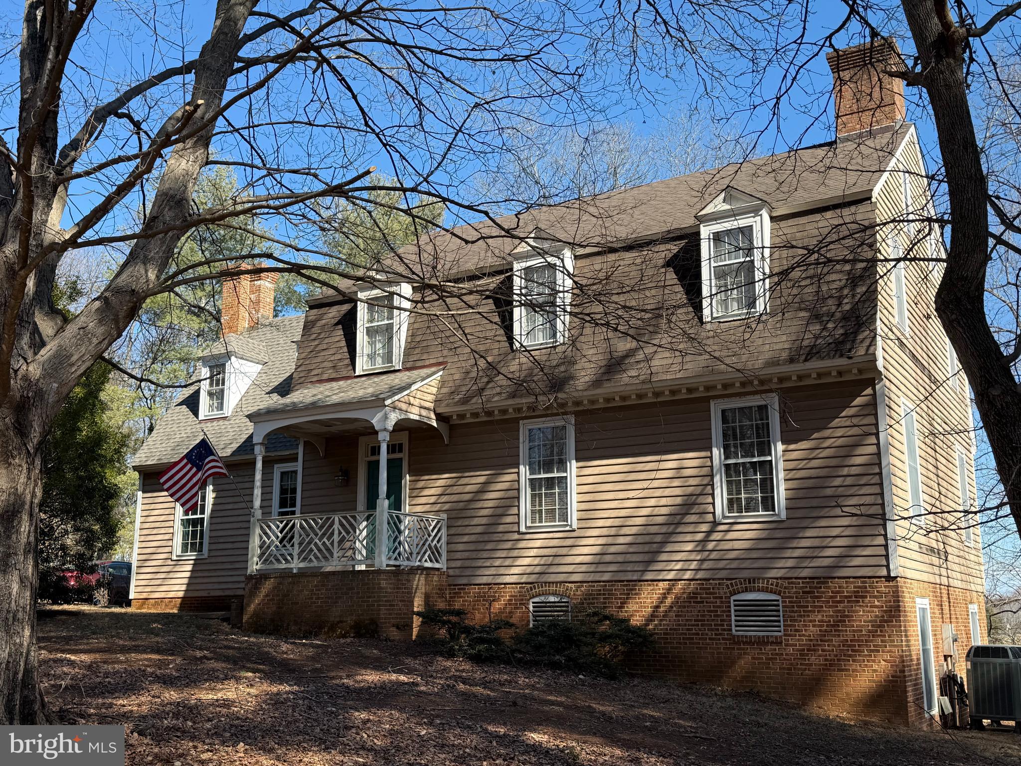 Nestled on a private 1.39 acre cul-de-sac lot within The Woods subdivision of surprising Culpeper this stunning Colonial Williamsburg-style home exudes classic charm and refined craftsmanship throughout. Master builder R. Bruce Tibbetts ensured every detail reflected the architectural beauty and elegance you come to expect in finely built custom homes. Five stately brick fireplaces add warmth and character to the inviting indoor living spaces, perfect for both intimate gatherings and grand entertaining. This spacious 3000 sq.ft. 4-bedroom, 2.5 bath home boasts hardwood floors, soaring 10' high ceilings, designer swag & jabots window treatments and handsome custom trim throughout. The well-appointed eat-in kitchen with newer Samsung double ovens, Bosch dishwasher and a JennAir cooktop is perfect for culinary enthusiasts. Your formal living and dining rooms are reminiscent of those found in 18th Century homes. Both are adorned with oak hardwood flooring while a custom designed raised panel, chimney breast accentuates your marble surround brick hearth living room fireplace with handsome wood mantle and eyebrow lighting. Your oak tread staircase with Chippendale railing reproduced from the Coke-Garrett House, Williamsburg leads to the 2nd floor bedrooms and hall full bath. The A-framed bedroom is complete with hardwood flooring, plastered fireplace, beaded trim, plank walls & doors.  The hardwood floored Master Suite is ready for your bathroom update. There’s a second staircase to the floored attic and a third staircase leading down to the library. A true bibliophile’s dream, your inviting library sanctuary is lined with bookcases and built-in window bench seating/storage, offering the perfect space to read, study, and relax. Enjoy cool breezes and scenic pastoral views sitting on your adjoining 22' x 10' screened porch while sipping your morning coffee or an evening glass of wine.  Plans to finish the 1500 sq.ft. basement with wood-burning fireplace and brick flooring didn’t come to fruition.  Five Andersen windows, shower stall and toilet covey. Exit your walk-out basement via a custom herringbone pattern door with beaded trim, hand forged hardware and Jack arch. Extras Include: Brand New Architectural Roof, Interior Recessed, Pendant and Sconce Reproduction Lighting, Hipped Dormers, Exterior Flood Lighting, Hexagon Tiled ½ Bath with Pedestal Sink, 2 Coat Closets, Chair, Crown & Wide Doorway Moldings, Pantry with Pull-out Shelving, Covered Front Porch with Chinese Chippendale Rail, Dentil Block Molding, Front Door with 5 Part Trim and Transom Window, Brick Arch Basement Windows, Brick Skirt, Crawl Space Storage under Rear Porch, Central Vacuum, 2 refrigerators, microwave, washer, dryer, 80 gallon Whirlpool Water Heater and Trane 2 Zone Heat Pump HVAC! The home is serviced by a private well and septic system.  Comcast provides fiber optic internet to this wonderful home. The Colonial Bead wood siding is awaiting the new owner’s choice of paint color at the new owner’s expense.  The owner prefers to sell the home as is. Culpeper, Virginia, named the “Prettiest Town in Virginia” by Architectural Digest, 2018, combines small town charm with big city convenience. Less than an hour's drive from Washington, DC, Fredericksburg, and Charlottesville, Culpeper is the perfect place to escape the congestion and enjoy a little country living.   Shenandoah National Park is less than 35 minutes from downtown. Culpeper, a Great American Main Street is filled with boutique shops, award-winning chef inspired cuisine and a thriving business community.  19389 Woods Road, with its impeccable attention to detail and historic-inspired design offers a rare blend of traditional and modern comfort. This exquisite one owner home provides a private setting with beautiful expansive views!  Priced very attractively at $545,000 with a Culpeper County assessed value of $544,800, taxes are estimated to be only $2561 this year.  No HOA! Come Quick!