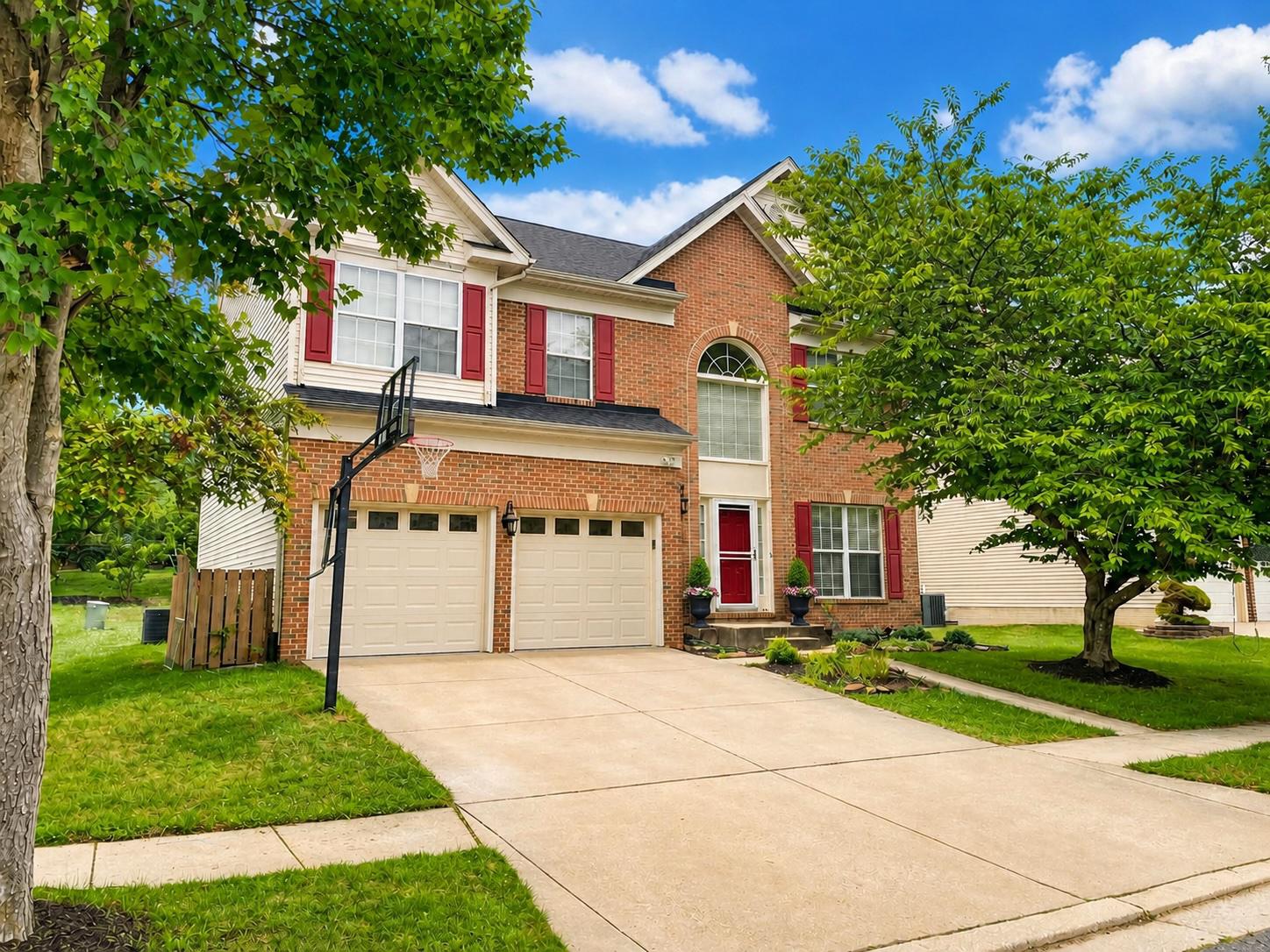OPEN HOUSE Sunday 7/26 12-2! Welcome to 7809 Reston Lane, a stately brick-front home that perfectly blends that offers the space and versatility today's buyers are searching for. From its commanding curb appeal to its thoughtfully designed interior and inviting outdoor living spaces, this beautifully maintained home offers the ideal setting for everyday living and entertaining. With its desirable location and exceptional features throughout, this is a home you'll want to see before someone else calls it their own.

A dramatic two-story foyer with a stunning Palladian window creates an impressive first impression. The beautifully appointed kitchen features 42-inch cabinetry, granite counters, stainless steel appliances, and a convenient coffee bar complete with wine storage and glass front cabinets. The kitchen flows effortlessly into the spacious family room with unique alcohol-fueled fireplace and to the sunroom.  

The formal living and dining room combination offers exceptional versatility and can easily serve as a home office, playroom, cocktail room with club chairs, or whatever best fits your lifestyle. The stunning sunroom provides the perfect space to relax with a morning cup of coffee, host gatherings, eat crabs, or style with some beautiful wicker furniture!

Upstairs, the spacious primary suite offers the perfect retreat with room for a sitting area while maintaining a comfortable, cozy feel, vaulted ceilings, and has a large walk-in closet.  The en-suite bath features a warm green vanity with dual sinks and a unique layout with two separate showers —one of which is ideal as a convenient dog-washing station until you're ready to personalize the space.  The additional bedrooms are all generously sized with ample closet space. Convenient upper-level laundry room makes everyday living easy!

The finished lower level offers endless possibilities with a spacious recreation room, wet bar area, full bathroom, fifth bedroom perfect as an office, yoga studio, craft room, or playroom due to no egress, and a storage room that provides plenty of space for seasonal items and organization.

Outdoor living is just as inviting with a charming patio featuring a pergola and fire pit—ideal for relaxing evenings or entertaining family and friends. An HOA common area located adjacent to the property creates an expansive, park-like setting and provides additional open space for play which you can see from the yard- and has walkable easement one house down between 7807 & 7803 Reston. 

Additional features include fresh paint, hardwood floors, new carpet, 9-foot ceilings, tons of natural light, and elegant southern-style columns adding architectural charm while subtly defining the living spaces. Peace of mind with newer roof 2017.

Conveniently located just minutes from The Avenue at White Marsh, White Marsh Mall, I-95, shopping, dining, parks, and major commuter routes, this exceptional home offers the perfect combination of style, space, comfort, and convenience.

Some photos AI Staged and Enhanced.