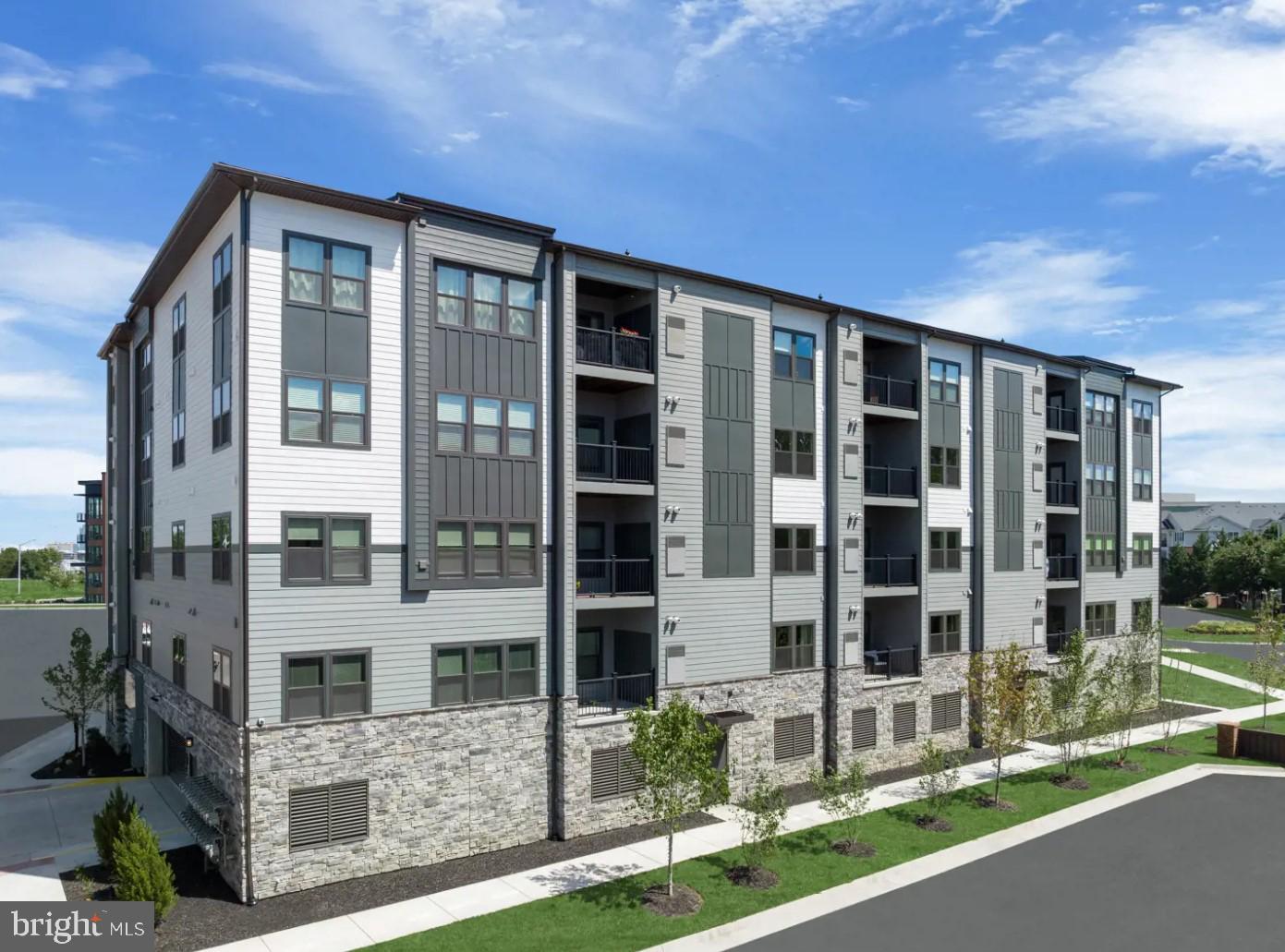 FIVE HUNDRED OFF THE FIRST MONTH'S RENT FOR FEB MOVE IN. RARE OPPERTUNITY TO RENT A BRAND NEW CONDO. NEVER BEEN LIVED IN! WOW! Welcome to this spacious 2-bedroom, 2-bathroom  elevator condo flat with a covered balcony, perfectly situated in a highly sought-after neighborhood of woodland station . Your assigned parking space awaits in the covered garage below for added convenience. The 9-foot ceilings flood the space with an abundance of natural light. Revel in the high-end designer finishes that make this home truly stand out, including 9-inch wide plank LVP flooring, exquisite quartz countertops, shaker-style cushion-close cabinetry, and a designer glass backsplash. Relax and unwind in your spa-like owner's shower featuring a glass enclosure and an upscale Emerge shower column, tile ledge, and tile floor. This home's location is unbeatable,  a commuter's dream, LESS THAN TEN MINUTES WALK away from the HERNDON METRO,  with a direct METRO route to DC. Enjoy easy strolls to grocery stores and dining options, with the popular Reston Town Center and Dulles Airport less than a 10-minute drive away. Plus, it offers convenient access to major commuting routes such as 28, the 267 toll road, Fairfax County Parkway, and more.