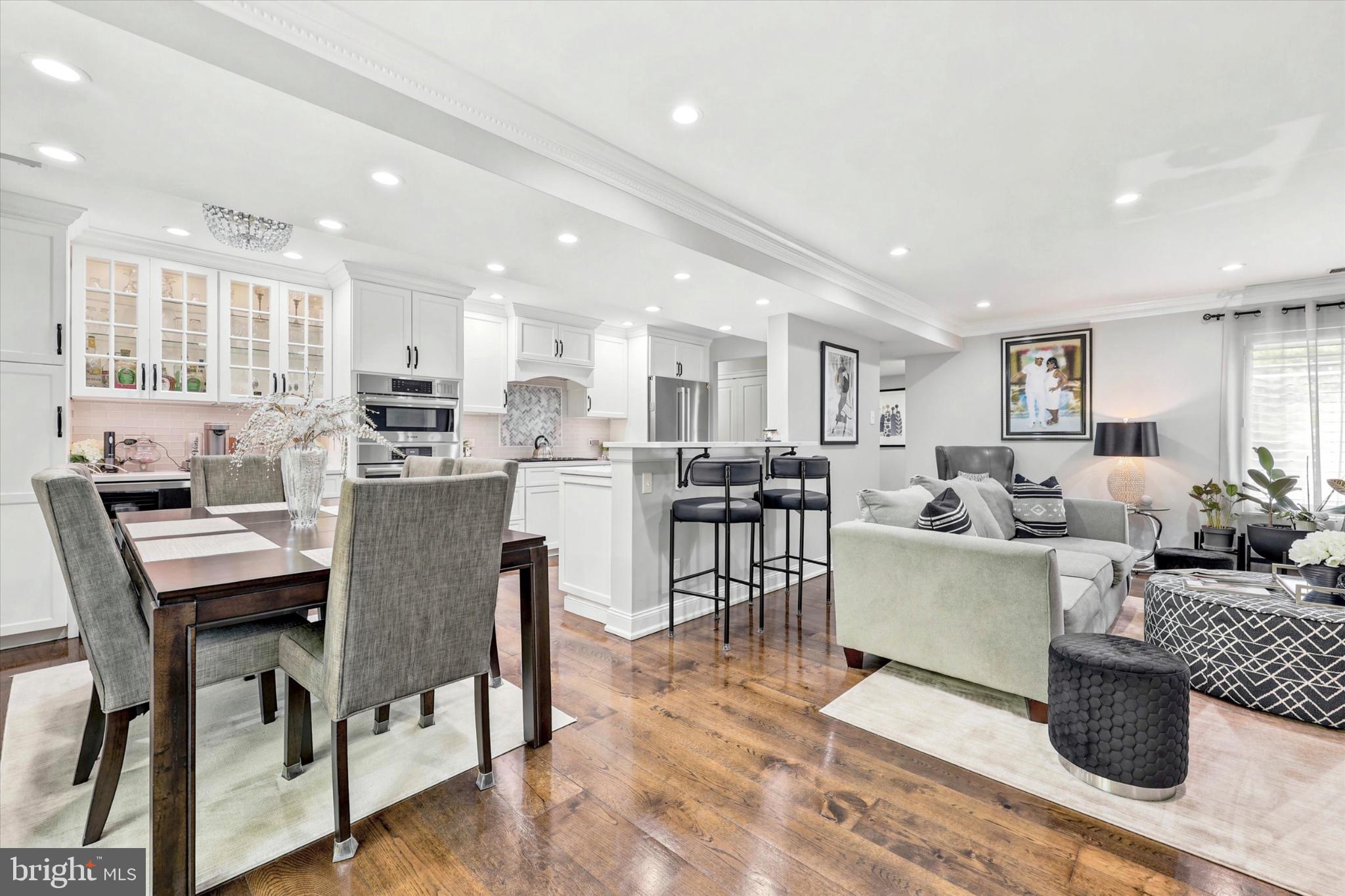 Beautifully renovated first-floor corner townhome in desirable Oak Hill Estates. This 2-bedroom, 2-bath home features a stunning open-concept kitchen with quartz countertops, custom cabinetry, Bosch appliances, and a Thermador gas cooktop. The spacious primary suite includes a walk-in closet and private bath. Hardwood floors, recessed lighting, and a wood-burning fireplace create a warm and inviting living space. Enjoy a private fenced patio, abundant natural light, and access to community amenities including a pool, fitness center, tennis and pickleball courts. Conveniently located in the award-winning Lower Merion School District with easy access to Center City Philadelphia, shopping, dining, and major highways.
