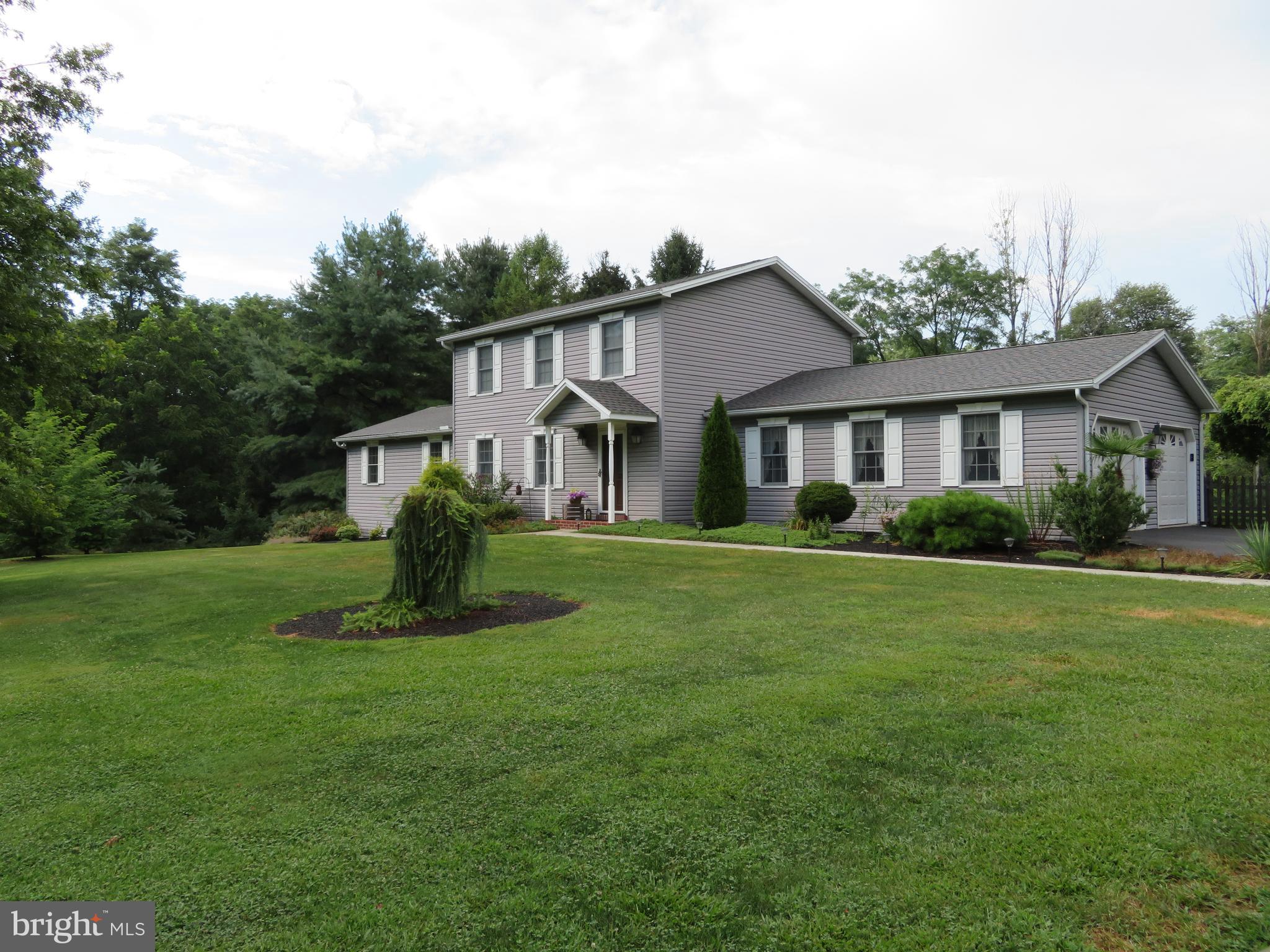 Let nature surround you here in this impeccably maintained home on 10 acres. Partially surrounded by Farm Preservation Land. Enrolled in Clean & Green. Quality wood floors and solid wood doors throughout; 4 bedroom, 3.5 Baths home with a first floor Master Suite, first floor Laundry Room, Updated Kitchen, 16 X 20 heated sun room overlooking the in ground pool and wooded backyard area. 3 additional bedrooms on the second floor with 2 full baths.Entertain often from the finished lower level with built in Bar and storage area to the outdoor patio space connecting  to the pool. Attached 2 car garage and Detached 1 car garage. Additional basement storage space. Franco Belge Coal stove conveys with the sale of the property. Quality built Ridgeview home.  North Dickinson Elementary. Move in ready!