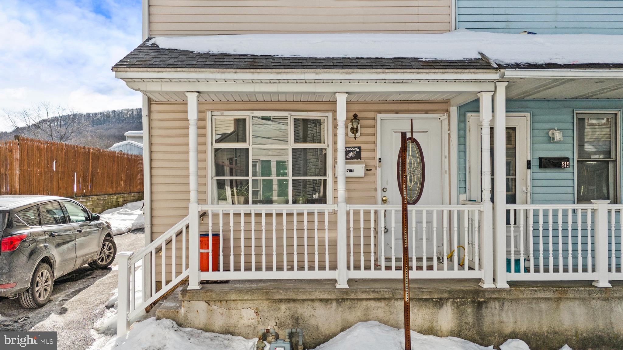 Welcome to 817 Grant St, a well-maintained, turnkey 3-bedroom, 1-bath rowhome offering excellent value for both owner-occupants and investors alike. This charming property features a welcoming front porch and the added convenience of a private driveway rare for homes of this style. Step inside to a spacious living room that flows seamlessly into a dining room combination, creating a functional and open feel. The kitchen is conveniently located just off the dining area and features ceramic tile flooring, oak-style cabinetry, laminate countertops, and recessed lighting. From the kitchen, enjoy direct access to the rear patio perfect for relaxing or entertaining. Upstairs, the second floor offers well-sized bedrooms and a full hall bathroom. One of the bedrooms provides access to a private second-floor deck, adding a unique outdoor retreat. The third-floor loft offers additional flexible space, ideal for storage, a home office, or bonus living area. Additional highlights include an updated electrical system, gas boiler with baseboard heat, and a rear yard complete with patio space. A shed is included and conveyed in as-is condition. Whether you're looking for a move-in ready home or a solid addition to your rental portfolio, this property is ready to go. Schedule your showing today!