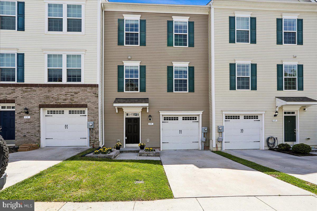Don't wait to see this tastefully updated townhome located just a block from downtown Thurmont!  Light and bright 3-level townhome with a garage is priced to go quickly.   Downtown Thurmont offers dining, entertainment and lots of community events.  There are 3 bedrooms and 2 full bathrooms on the upper level and a laundry closet  for your convenience..  The main level has an over-sized kitchen, family room with dining area and a powder room.  Sliders lead to a beautiful Trex deck from the kitchen and overlooks trees and grassy areas behind the townhome.  Lower level features an ample garage, large Rec Room that can also be a 4th bedroom and a full bathroom.  There’s approximately 2,004 sq. ft. of living space and it’s all  beautifully lit with lots of ambient light from many windows throughout.  Gleaming hardwood floors, recessed lighting, quartz counters, new carpet and new paint.  It’s move-in ready and waiting to be yours!