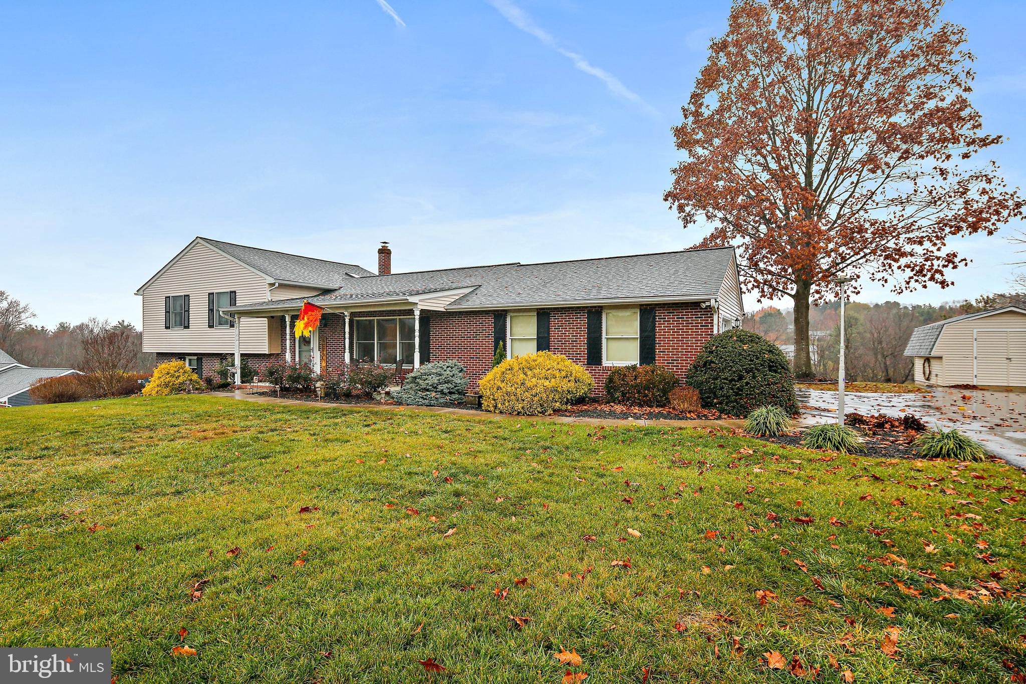 Absolutely lovely setting! This gorgeous split level has been perfectly maintained by the meticulous sellers! The roof was replaced in 2015. The HVAC was replaced in 2014. Most window sashes were replaced in 2020.  The kitchen and bathrooms have been updated, and the carpet is new.  Freshly refinished hardwood floors! Living room entry, which leads to a rear kitchen and dining room overlooking the covered deck. Absolutely beautiful views from the back yard and deck! Three spacious bedrooms upstairs, including a primary bedroom with en suite bathroom. Large family room and walk out to the back yard on the lower level, as well as a full bathroom. Lovely propane fireplace with smart thermostat and brick hearth. There is even another level! Partially finished to include an additional bedroom, and excellent storage space.  Large two car garage, insulated and drywalled, with utility sink. This is such a lovely home, full of warm and welcoming spaces, and set on a spectacular lot!