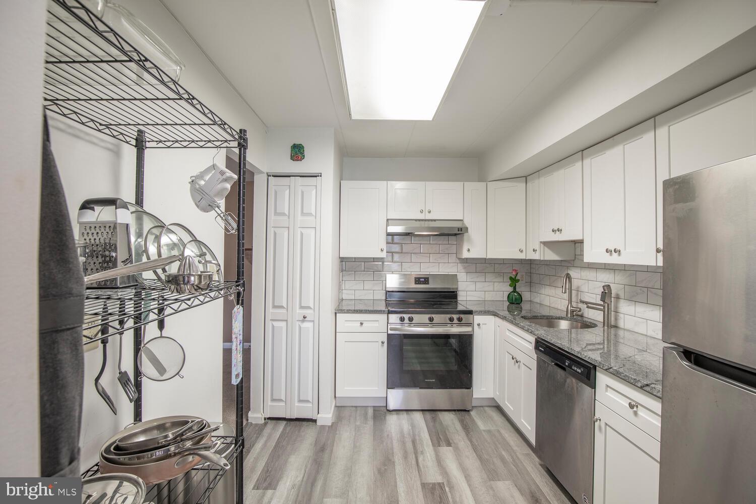 This inviting 2-bedroom, 2-bath Meadowood condo offers a wonderful combination of comfort, style, and low-maintenance living. Perfectly positioned on the second floor with a balcony, this light-filled home enjoys peaceful views of the lawn and community pool—an ideal backdrop for relaxing and unwinding. Step inside to find a freshly painted interior and a completely renovated kitchen that’s as functional as it is beautiful. Featuring granite countertops, stainless steel appliances, a subway tile backsplash, new flooring, and a convenient pantry. The open living and dining areas flow naturally together, offering a bright, welcoming space for both everyday living and easy entertaining. The spacious primary bedroom includes plush carpeting, a walk-in closet, and an en-suite bath with a stall shower. The second bedroom is equally inviting, ideal for guests, a home office, or flex space, and is served by another full bathroom. Enjoy the simple pleasures of Meadowood living: a refreshing community pool, beautifully maintained grounds, and a convenient location close to shopping, dining, and major commuter routes. Stylish, comfortable, and move-in ready—this Meadowood condo is ready to welcome you home!