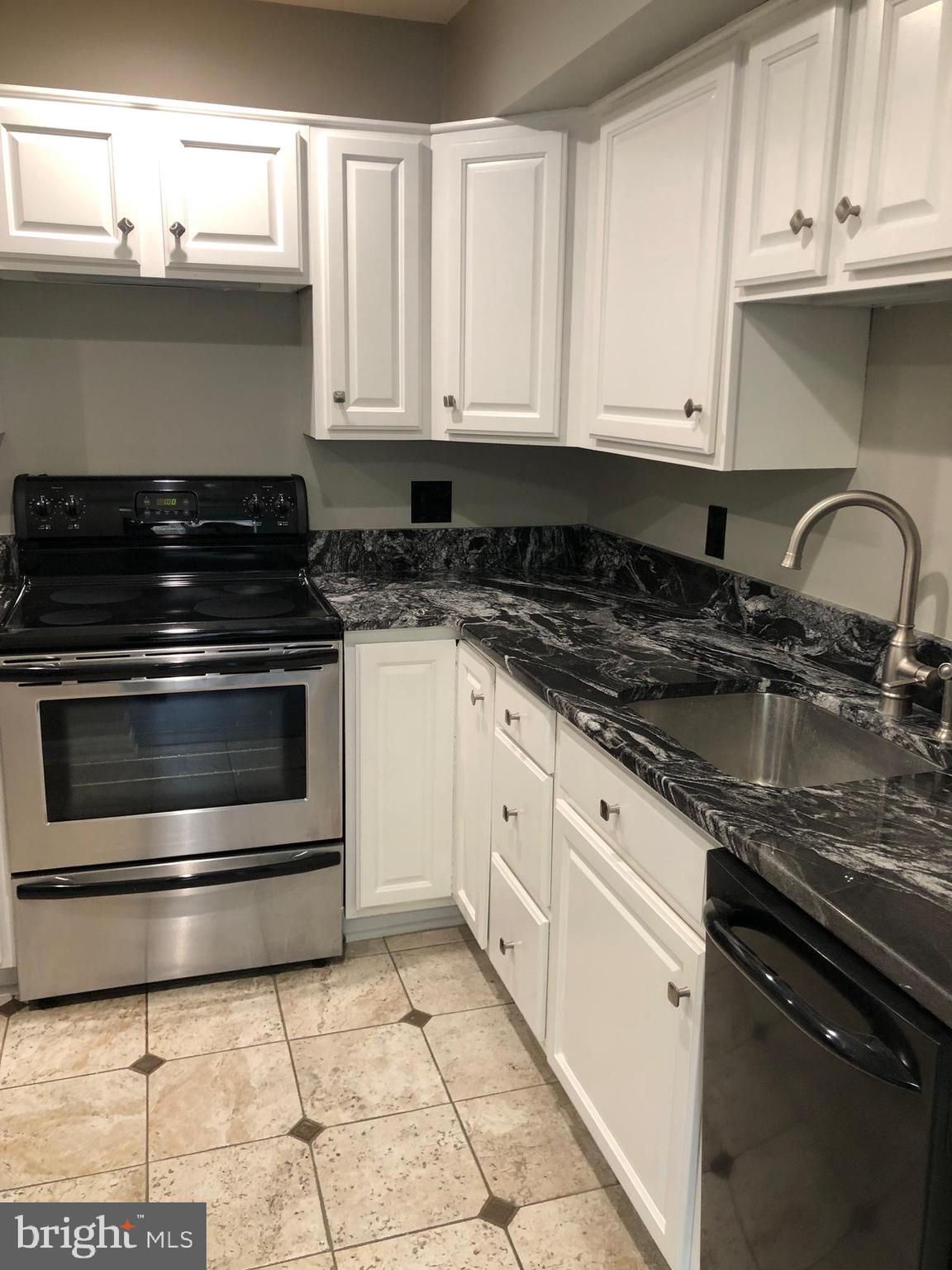 Fully renovated, rare ground level 1BR, 1BA in Old Georgetown Village.  New hardwood floors throughout, washer/dryer, tile bathroom, recessed lighting, granite countertops, stainless steel appliances.  Rent includes parking and water!  Outdoor pool and tennis courts.  Just a 5 minute walk to Whiteflint Metro Station, Pike and Rose, Whole Foods, Shriver Indoor Swim Center and other shopping/restaurants.