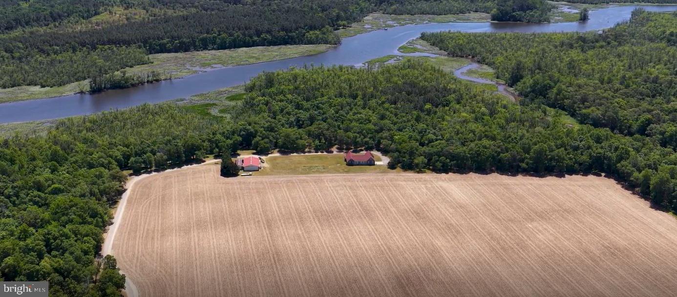 Waterfront Farm - Located along the shores of Marshy Hope Creek, this 113.14-acre farm, with an additional 1.322+/- acre adjoining lot, offers a rare blend of productive farmland, natural beauty, and thoughtfully maintained improvements. Approximately 52.6 acres are tillable and farmed for small grain, offering excellent agricultural opportunity. The remaining acreage comprises mature, open woodlands with cleared paths, suitable for nature walks and ATVs, that gently slope from the homesite down to the water’s edge.

The meticulously maintained, single-story 3,270 sq ft home features one-story living. Cathedral ceilings, expansive living spaces, and an inviting layout designed for both comfort and entertaining. The home features three bedrooms and two-and-a-half bathrooms with a functional layout designed for both privacy and everyday living. Radiant floor heating provides consistent warmth throughout the home, reflecting the quality construction and ongoing care of the property. The home is set up for self-sufficiency with an outdoor wood boiler surrounded by a forest full of fuel. Maintained inside and out, the home is move-in ready and offers a rare combination of size, condition, and single-level design.

Equestrian and farm amenities include a pole building with two horse stall doors, as well as an additional open shed for equipment or storage, and a water hydrant. Subdivisions are available with soils favorable for obtaining perc permits to create your own family compound. Whether you are seeking a working farm, recreational retreat, horse property, or private waterfront estate, this remarkable property is a great investment opportunity.