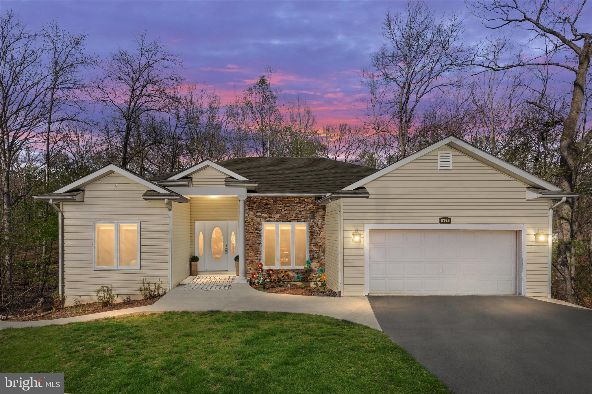 Welcome to Lake Holiday, where everyday living feels like a getaway. Set within one of the area's most sought-after gated lake communities, this beautifully maintained home offers the perfect blend of comfort, flexibility, and resort-style living.

The main level features 3 bedrooms and 2 full baths, including a spacious primary suite with a beautifully renovated bath featuring a walk-in shower and stylish tile finishes. The open-concept kitchen is designed for gathering, complete with granite countertops, stainless steel appliances, a large center island, and seamless flow into the inviting family room with vaulted ceilings and a cozy gas fireplace.

One of the standout features of the home is the expansive screened-in porch—an incredible extension of the living space that feels like a private treehouse retreat, perfect for morning coffee, outdoor dining, entertaining, or simply relaxing among the wooded surroundings.

The lower level offers exceptional flexibility with its own living space, including a bedroom, full bath, kitchenette, private laundry, family room, and direct access to a private deck—ideal for guests, multigenerational living, hobby space, or a private retreat for extended stays. Additional storage space provides even more room for seasonal items, recreational gear, and organization.

And for an added bonus? The seller is including their pontoon boat with an acceptable offer—making it even easier to jump right into the Lake Holiday lifestyle from day one.

Beyond the home itself, Lake Holiday offers an exceptional lifestyle with access to a 240-acre lake, beaches, marina, clubhouse, tennis courts, playgrounds, and recreational amenities that make every season enjoyable.

Whether you're looking for full-time living or a home that feels like a year-round escape, this property offers space, versatility, and the lifestyle buyers are searching for.