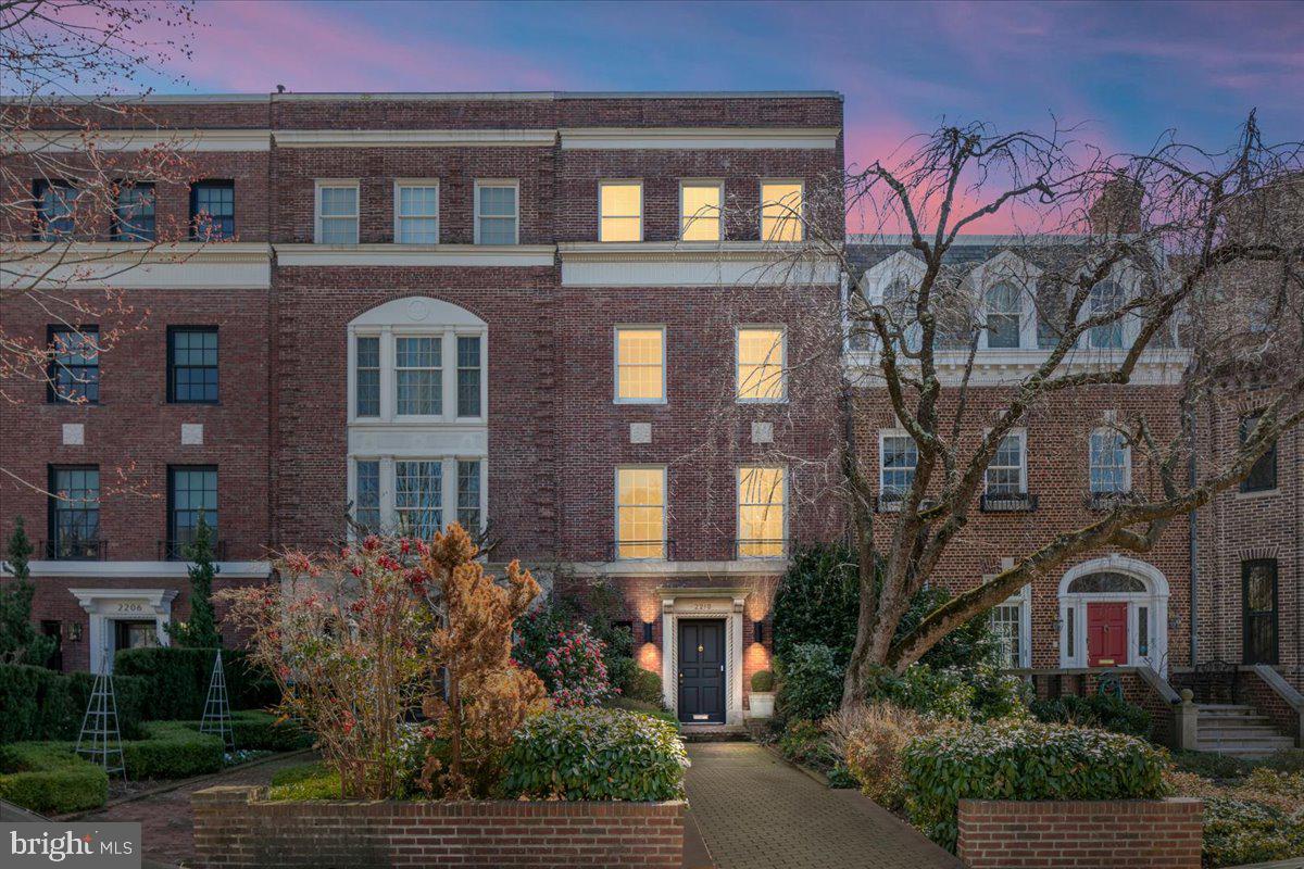 Stately brick townhome on a quiet, tree-lined street in the coveted Kalorama neighborhood of Washington. This exceptional residence showcases grand proportions, soaring ceilings, elegant architectural details, and multiple fireplaces that reflect timeless craftsmanship. Designed for both formal entertaining and comfortable daily living, the multi-level layout offers expansive living and dining spaces, refined bedroom suites, and flexible rooms ideal for a library, office, or guest quarters. A private courtyard provides a serene outdoor retreat, while the rare detached two-car garage adds everyday convenience. Ideally located near acclaimed dining, Rock Creek Park, and key commuter routes, offering effortless access to Downtown, Dupont Circle, and surrounding neighborhoods.