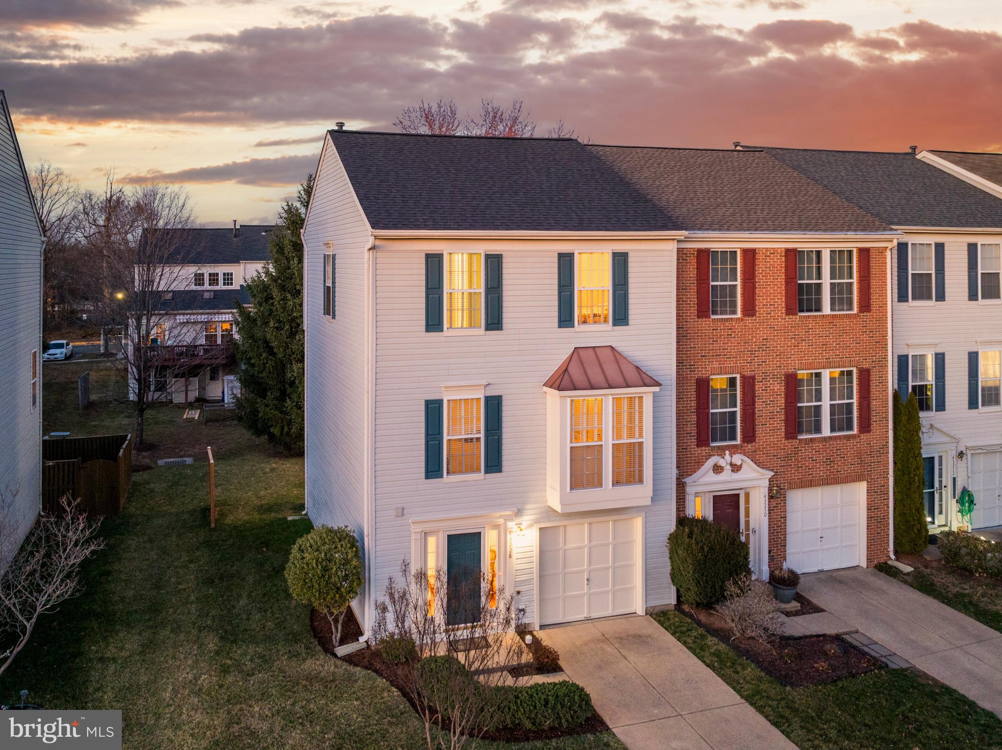 Discover this beautifully maintained 3-bedroom, 2.5-bath end-unit townhome with a garage in the sought-after Ashburn Farm community, offering over 2,248 square feet of finished living space and a rare three-level extension for added space and functionality. The Ryan Homes Providence model features an expansive luxury primary suite with dual closets, a cathedral ceiling, and an ensuite bath with a soaking tub, shower, and dual vanity. The main level boasts an oversized family room, a formal dining room, and a gourmet kitchen with a large island—a feature only available with this extension—plus a sunroom addition with space for a future deck. The lower level includes a spacious rec room, bonus room, and a separate walk-out entrance to the private backyard, making it an ideal home office or additional living space. Freshly painted with new carpet and flooring, this original-owner, non-smoking home has been meticulously cared for, featuring a new roof with architectural shingles and a transferable warranty, new LG stainless steel kitchen appliances, updated plumbing and electrical fixtures, and a recently serviced HVAC (replaced in 2017). The long driveway and generously sized garage offer plenty of parking and storage. Set on a quiet cul-de-sac, this home provides privacy, a larger yard, and easy access to major commuter routes, including Rt. 7, Rt. 28, and the Dulles Greenway. Conveniently located just 10 minutes from Ashburn Metro Station (Silver Line) and 12 minutes from Dulles International Airport, with a short walk to Loudoun County Transit stops with direct routes to Ashburn Station (Metro SmarTrip cards accepted), Trailside Park, award-winning Stone Bridge High School and Trailside Middle School, Ashburn Library, the W&OD Trail, a community pool, and tot lots. Ashburn Farm offers an impressive range of amenities designed to enhance residents' lifestyles. The community features three swimming pools—Windmill, Breezyhill, and Summerwood—open from late May through Labor Day, as well as twelve tennis courts, some of which are equipped for pickleball and evening play. Residents can also enjoy nineteen playgrounds designed for children aged 5-12, several basketball courts, and nearly thirty miles of scenic asphalt trails perfect for walking, biking, and outdoor exercise. The Windmill Pavilion provides a great space for gatherings and events, while the Community Center offers rental rooms, including the DeLong Room and a lower-level meeting room, for private functions. With a strong focus on recreation and community engagement, Ashburn Farm hosts year-round social events and activities, making it one of Ashburn's most desirable neighborhoods. Plus, with a low HOA fee of $119.26 per month covering trash/recycling pickup, townhome street snow removal, and common area maintenance, this home offers an unbeatable value in one of Ashburn’s most desirable neighborhoods. Close to tons of shopping to include Whole Foods/Trader Joes and great restaurant options. Notable upgrades include Roof 2025, HVAC 2017, LG Stainless Appliance Package 2025, Water Heater 2024, Garbage Disposal 2024, Paint (interior & exterior) 2025, Carpet 2025, Updated plumbing fixtures 2025, Updated lighting fixtures 2025. W/D 8 years old.  Transferable Virginia Green lawn service plan.