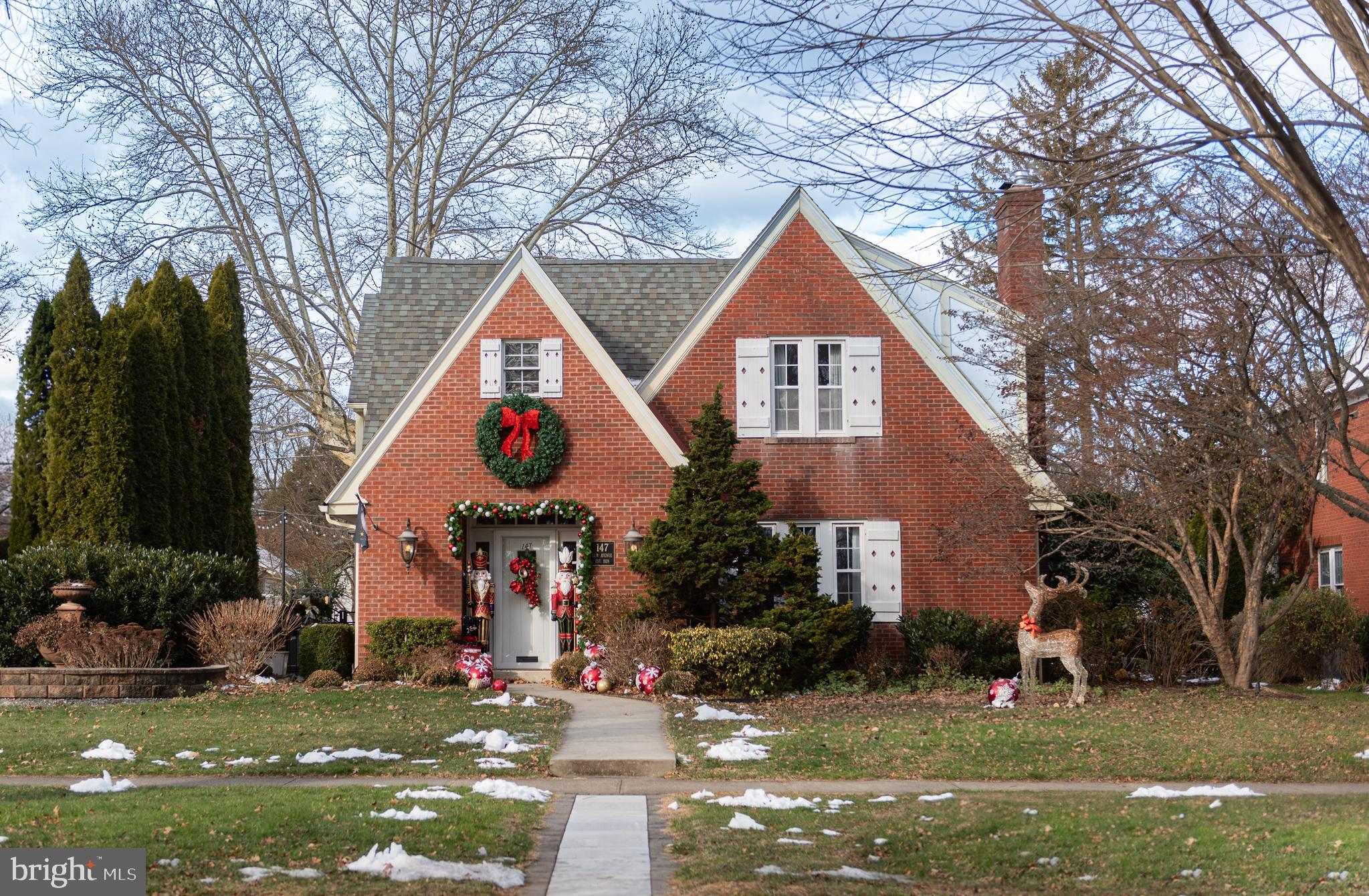 Welcome to 147 Elm Avenue, located in the heart of Hershey. With a timeless brick exterior, this charming, turn-key home has been updated and upgraded throughout and offers over 3,400 SqFt of above grade living space.  You'll appreciate the curb appeal of the classic gabled architecture and professional landscaping that reflects years of thoughtful care. The mature trees and vibrant gardens creates a sense of warmth while also providing privacy. The chef's kitchen is the heart of the home- perfect for everyday living and entertaining alike. A generous center island offers seating for casual meals, conversation or homework and an abundant amount of space for food preparation along with a culinary sink . A second sink offers a clean  zone and an additional work station. The spacious walk-in pantry features custom shelving and exceptional storage that keeps things beautifully organized. Friends and family will want to gather here! The floor plan flows into the spacious dining room with built in benches for storage and louvered plantation shutters . Working remotely? The first level bedroom could also be used as an office. It has an attached full bath with a walk-in shower- ideal for in-laws or guests. Relax by the cozy gas fireplace in the living room or watch television in the den. A half bath and a mudroom- where shoes or backpacks can be stored, round out the first level. Retire to the primary bedroom which offers a large walk-in closet and an additional second closet sure to please shoppers! The spa inspired ensuite has a walk-in tile shower and granite countertops. There are two additional good size bedrooms, another full bath and a 2nd level family room, office or gaming room- endless possibilities! The finished lower level expands the living space with a spacious recreation room- a perfect spot to watch the big game or exercise. Store your seasonal items and holiday decor in the unfinished area - you can't have too much storage! The outdoor living is equally inviting!  The fenced in backyard has an expansive, low maintenance composite deck, cafe lighting and mature landscaping creating  a private oasis for gatherings, a game of catch or listening to concerts! The two car garage will save you from scraping ice and snow from your vehicle and offers additional storage. Located approximately 2 miles to Hershey Medical Center and within walking distance to Hershey Schools, in-town shops and restaurants and the recreation center,  schedule your showing today! 147 Elm is more than a home- It is a place where modern elegance, warmth and an ideal location come together in one of Hershey's most treasured settings.
