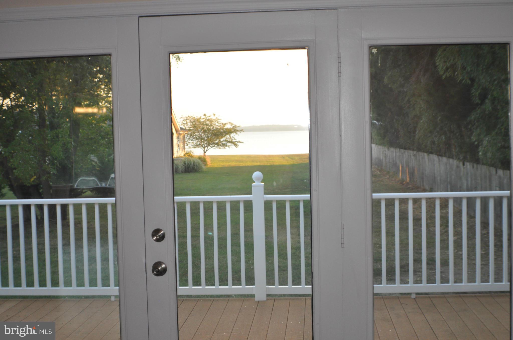 AFFORDABLE WATERFRONT - Home has been completely remodeled - like new! Gorgeous sunsets, nice open kitchen w/cherry cabinets & granite counters, SS appliances, ceramic floor, maintenance free deck across back, casement windows & beautiful hardwood floors throughout - open floor-plan w/dramatic cathedral ceilings, Circ driveway -Owner in process of installing $19,500 pier!
