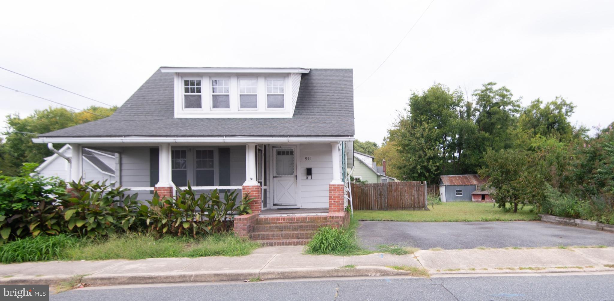 2 bedroom, 2 bath craftsman home - needs work. Nice in-town location - situated on double lot - large back yard with shed. Sold AS IS-