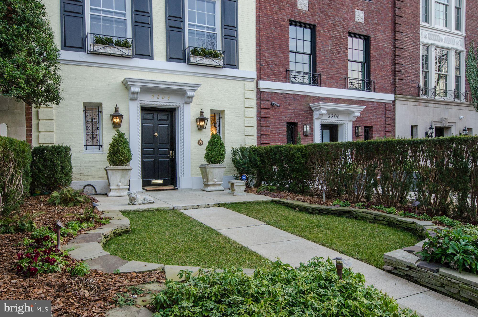 A grand, impeccably restored international-style residence, set in esteemed Kalorama, among homes of former presidents, ambassadors, diplomats, and luminaries. The gorgeous brick facade and formal entrance garden lead to the extraordinary interior, boasting luminous original architectural details, stunning formal entertaining rooms and numerous thoughtful custom features. A large marble receiving foyer with mirrored doors leads to the grand staircase. The gorgeous living room features oversized windows and a fireplace with original mantle, exuding the timeless elegance of the home's past, refreshed by its thoughtful renovation. The sumptuous dining room with gleaming hardwood floors, impressive crystal chandelier, and built-in full bar allows for gracious formal entertaining. Lovely floor-to ceiling french doors lead to the wrap-around deck. The highly functional kitchen by Jennifer Gilmer features high-end stainless appliances and a wonderful marble breakfast bar for casual dining. A wall of french doors opens to the wrap-around deck, affording access and views to the brick courtyard. This enchanting patio with fountain, accented by custom ironwork decorative doors, is reminiscent of a secluded Paris garden. The upper floors feature a distinctive walnut paneled library, perfect to retire to after dinner. There are five beautifully appointed bedrooms, all with custom en-suite spa-inspired marble baths. The bedrooms are enhanced by custom walls of closets. The upper floor has a laundry room and the home is drenched in sunlight from the stained glass skylight, illuminating the staircase. The receiving foyer, with its elegant Avonazzetto-Brecciano marble powder room and cedar coat closet, is separated from the modern family/media room by the mirrored doors off the foyer. This area accesses the kitchen through the rear stairs and includes a suberb wine cellar. In the rear is a nanny/au-pair suite with full bath, also opening to the rear brick courtyard patio. The oversized two car garage with extra storage completes this extraordinary Kalorama residence, only six miles to Reagan National Airport and ten minutes to the White House.