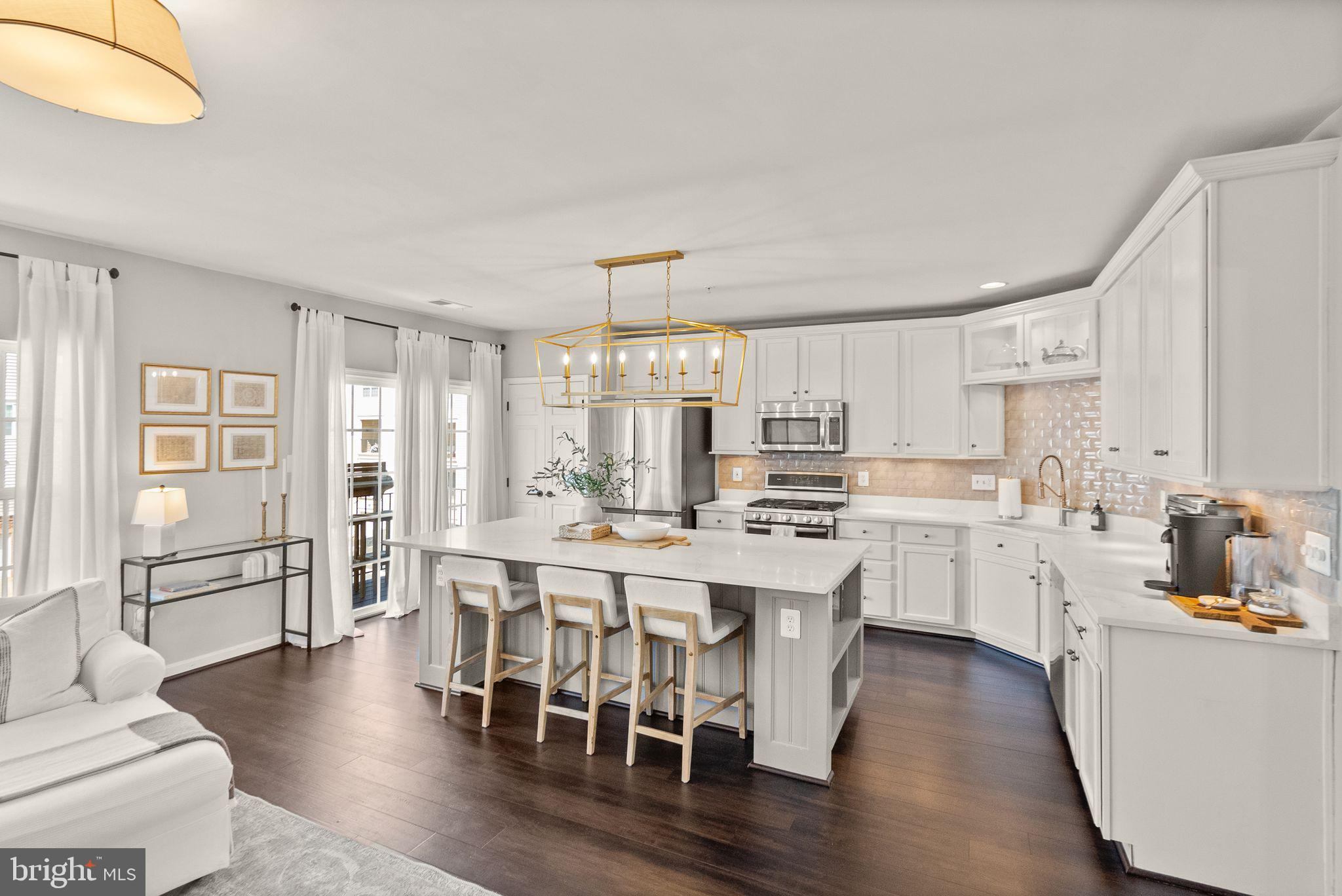 ***Offer Deadline: Seller requests highest and best by Sunday May 4th at 6pm***Stunning, Move-In Ready Condominium in Sought-After Brambleton Town Center!

Step into this beautifully updated 3-bedroom, 2.5-bath home that looks like it’s straight out of a magazine! Located in the heart of the Brambleton Town Center community, enjoy access to pools, parks, sports courts, and endless neighborhood amenities—all just steps from your front door.

Inside, you’ll find brand-new hardwood flooring throughout and a light-filled, open-concept layout designed for both entertaining and everyday living. The recently renovated gourmet kitchen shines with stainless steel appliances, a large center island, and a built-in wine/beer fridge—perfect for hosting! Just off the kitchen, step outside to a charming balcony—ideal for your morning coffee or a cozy evening unwind. The adjacent family room with fireplace offers a warm and inviting space to relax.

A separate dining room, spacious living room, and dedicated main-level office provide incredible flexibility and function.

Upstairs, the spacious primary suite is your personal retreat, featuring a luxuriously renovated spa bathroom with modern finishes and a relaxing vibe. Two additional bedrooms, a full hall bath, and a convenient upstairs laundry room complete the upper level. 

This home also includes a private one-car garage, offering added convenience, security, and extra storage space—perfect for busy lifestyles.

Don’t miss this opportunity to own a turnkey home with top-to-bottom updates in one of Loudoun County’s most vibrant communities!