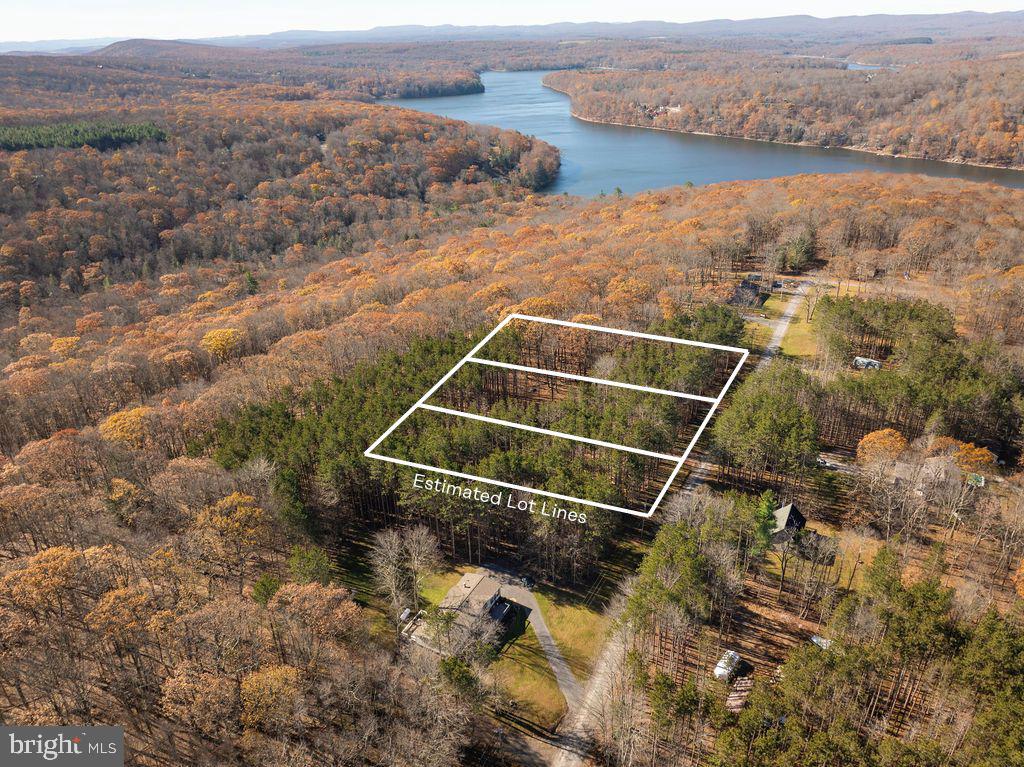 NEW in the Deep Creek Lake and WISP Resort area: three lots at .46 acres each (total is 1.38 acres)! Whether you envision a cozy cabin or a luxury lodge, this parcel offers the ideal blend of seclusion and accessibility.  Property Highlights: Private well water source already in place, 200 AMP electric service connection, Approved perc test suitable for a 4-5 bedroom home, Privacy with convenience; close to main roads, yet tucked away for peace and quiet. With endless hiking, boating, and skiing opportunities, you’ll experience all that mountain living has to offer.  Bring your builder and your imagination — this lot is ready for your next chapter!
