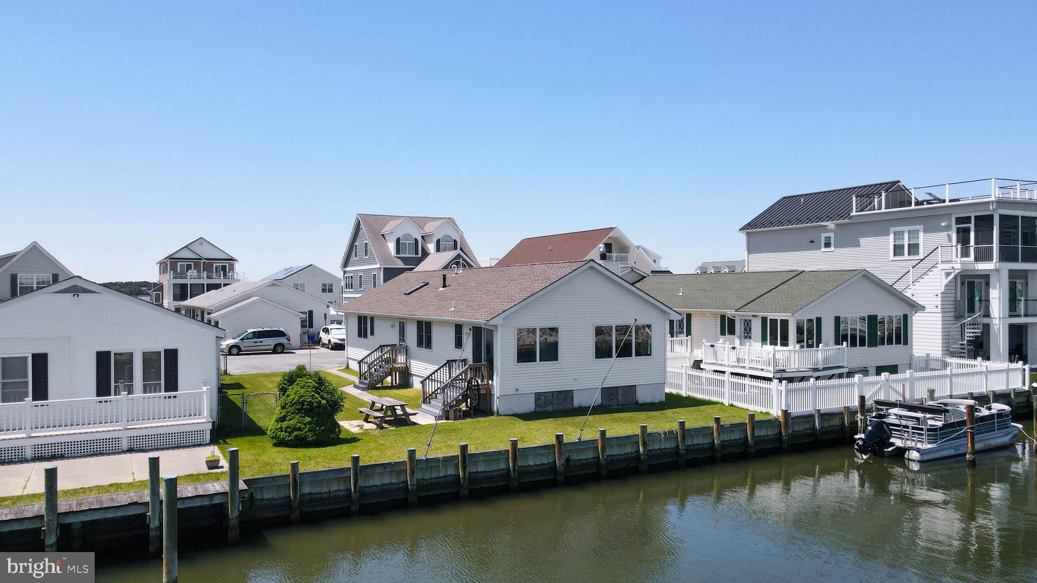 Experience waterfront living in the sought-after Cape Windsor community of Selbyville! This charming one-story, stick-built home offers 3 bedrooms and 2 bathrooms with endless potential to make it your own. Situated on a canal with direct access to Assawoman Bay, this property is a boater’s paradise — perfect for fishing, kayaking, jet skiing, or simply enjoying life on the water. Bring your boat and dock with ease along the bulkhead (installed 11 years ago)  with mooring whips. 

Enjoy peaceful waterfront views just minutes from Fenwick Island State Park beaches, dining, and entertainment. Cape Windsor amenities include a pool, playground, private beach area, and boat launch, all with low monthly fees. A fantastic opportunity to enjoy coastal waterfront living near the beach!