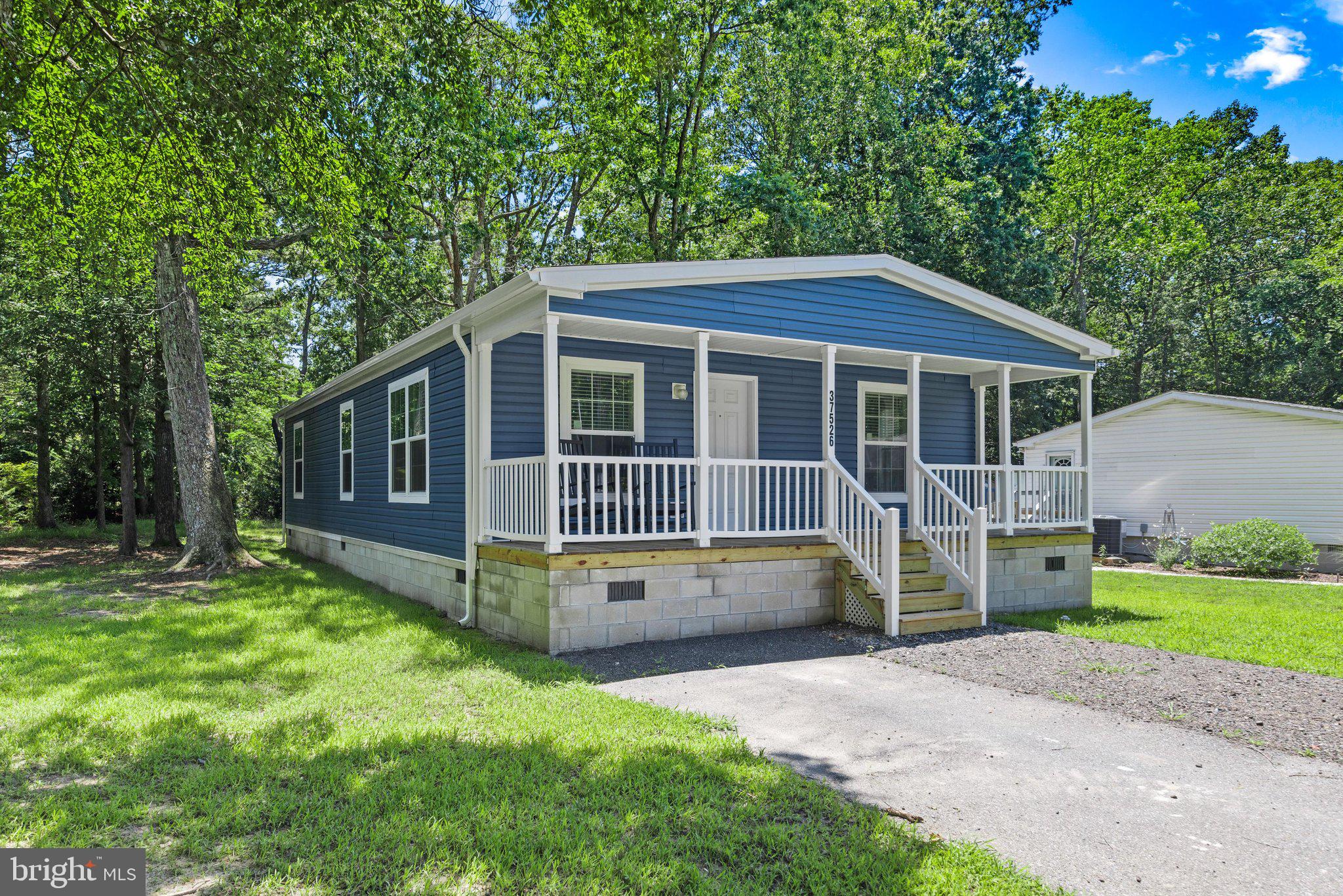Exceptional value with a new price! Welcome to coastal living at its finest! This beautiful new partially furnished home offers 1445 square feet of thoughtfully designed living space in a quiet Ocean View community, just minutes from the beach. 

Inside you'll find 3 bedrooms and 2 full bathrooms, along with a spacious living room, a large kitchen with island seating, and a dedicated dining area. The private primary suite, paired with a split-bedroom layout, provides added comfort and privacy for both residents and guests. Step outside to the full-length covered front porch, ideal for relaxing with your morning coffee, entertaining guests, or just enjoying warm Delaware evenings. 

Whether you're searching for a year-round residence, a vacation home, or a retirement retreat, this home offers the perfect blend of comfort, convenience, and coastal charm. Schedule your tour today!