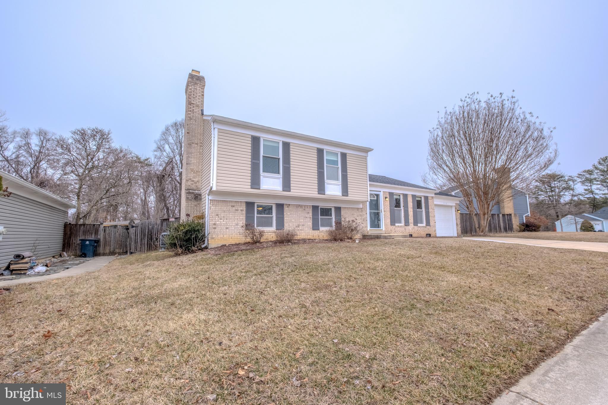 Motivated Seller!!! Charming split-level home in highly sought Montpelier Woods – A Must-See! Welcome to this stunning brick and vinyl front home that blends comfort, security, and plenty of updates! Renovations completed in 2024 include: Roof Replacement, New HVAC System, 200A Electric Panel Upgrade, 48A Electric Vehicle Charger Installation, Crawl Space Insulation and Encapsulation, and new paint throughout! Walk up the recently widened driveway that can accommodate up to four cars for ample parking. Step inside the front door to discover a cozy first level containing: living room, kitchen, and dining room, with access to a massive rear deck and extended one car garage. The upper level boasts three spacious bedrooms and two full bathrooms. Each bedroom is carpeted, providing a spacious closet and ceiling fan/light combos to keep the home cool during the summer. Enjoy additional entertainment space in the fully finished lower level, perfect for man-cave/home office combo, or simply an additional family room. The lower level is half below grade, providing two large windows for plenty of sunlight and another door to walk out to the large fenced in rear yard. Lower level utility room includes plenty of storage space, along with frontload washer/dryer combo, only 2 years old. Utility room has plenty of potential for an additional bathroom (already including rough-ins for plumbing). Sitting on a .26 acre lot, the large back yard contains a 15ft x 10ft shed and plenty of landscaping that is ready for your personal touch, ideal for gardening enthusiasts or pool installation. This home offers versatility, security, and enough upgrades to ensure low maintenance costs for a very long time. Don’t miss out on this incredible opportunity! Schedule your showing today!