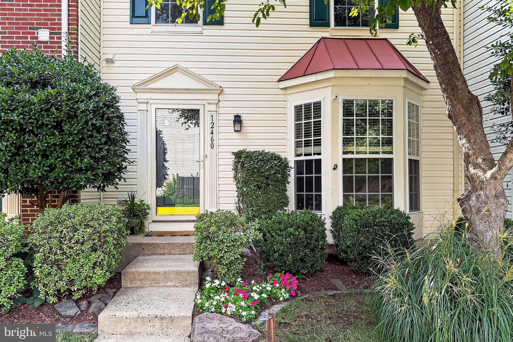 **Open house Saturday, 7/18 1-2pm**Welcome to this spacious three bedroom townhome in the sought-after Braemar community!  The three-level bump-out provides extra living space on every floor, while the modern kitchen and beautiful bathrooms have already been updated so you can simply unpack and enjoy!  You'll fall in love with the wood floors, nine foot ceilings, bay window, and charming deck that backs to peaceful woods.  Located just a few blocks from the elementary school, neighborhood amenities, parks, swimming pool and walking trails, this home combines comfort, convenience, and an unbeatable location.   Other features include a large finished basement with bonus room, full bath, and gas fireplace.  Walk right out from the basement to a fenced back yard with patio.  The large primary bedroom has vaulted ceilings, a walk in closet and attached bathroom with brand new LVP flooring, soaking tub and a standing shower.  There is ample parking for the unit with two assigned parking places directly in front of your door plus plenty of visitor spots.  Close to shops, dining, schools, commuter rail and major roadways.  Complete HVAC system 2019, water heater 2019.  Roof being replaced 2026.  Come see why this home is so easy to fall in love with before someone else does!