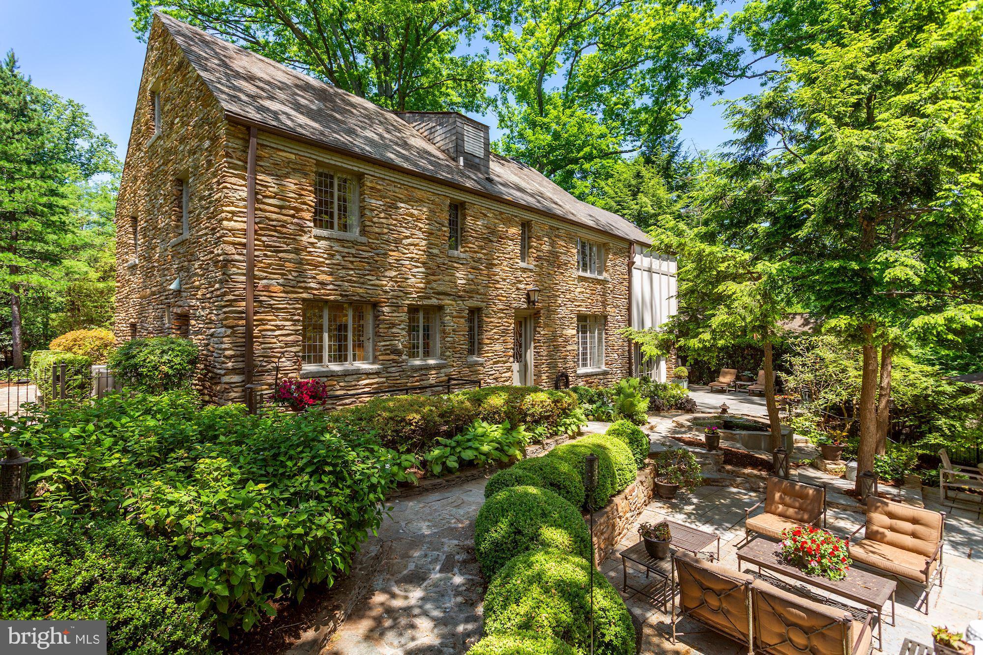 Welcome to 2750 Brandywine St NW, located in the Forest Hills neighborhood of Washington, DC on a quiet street in close proximity to Rock Creek Park.  This 1932 built home has been tastefully renovated yet has kept its unique charm and many original details, from the the leaded windows to the Mahogany doors and bannisters and the timeless, slate roof. The over 5000 square foot, fieldstone colonial is constructed on four levels.  The main level offers a renovated kitchen in 2020 with high end appliances and custom cabinetry, refinished hardwood flooring in the spacious, living room and den and a large dining room.  The upper two levels boast five bedrooms and three renovated bathrooms, also completed in 2020.  Rounding out the renovations, the lower level has newly installed tile flooring, a fourth full bath, and fabulous laundry room with quartz counters. The exterior is an entertainer's dream with terraced, flagstone patios, wrought iron fencing, a koi pond, extensive exterior lighting and landscaping, and a large area for a new owner's future use.