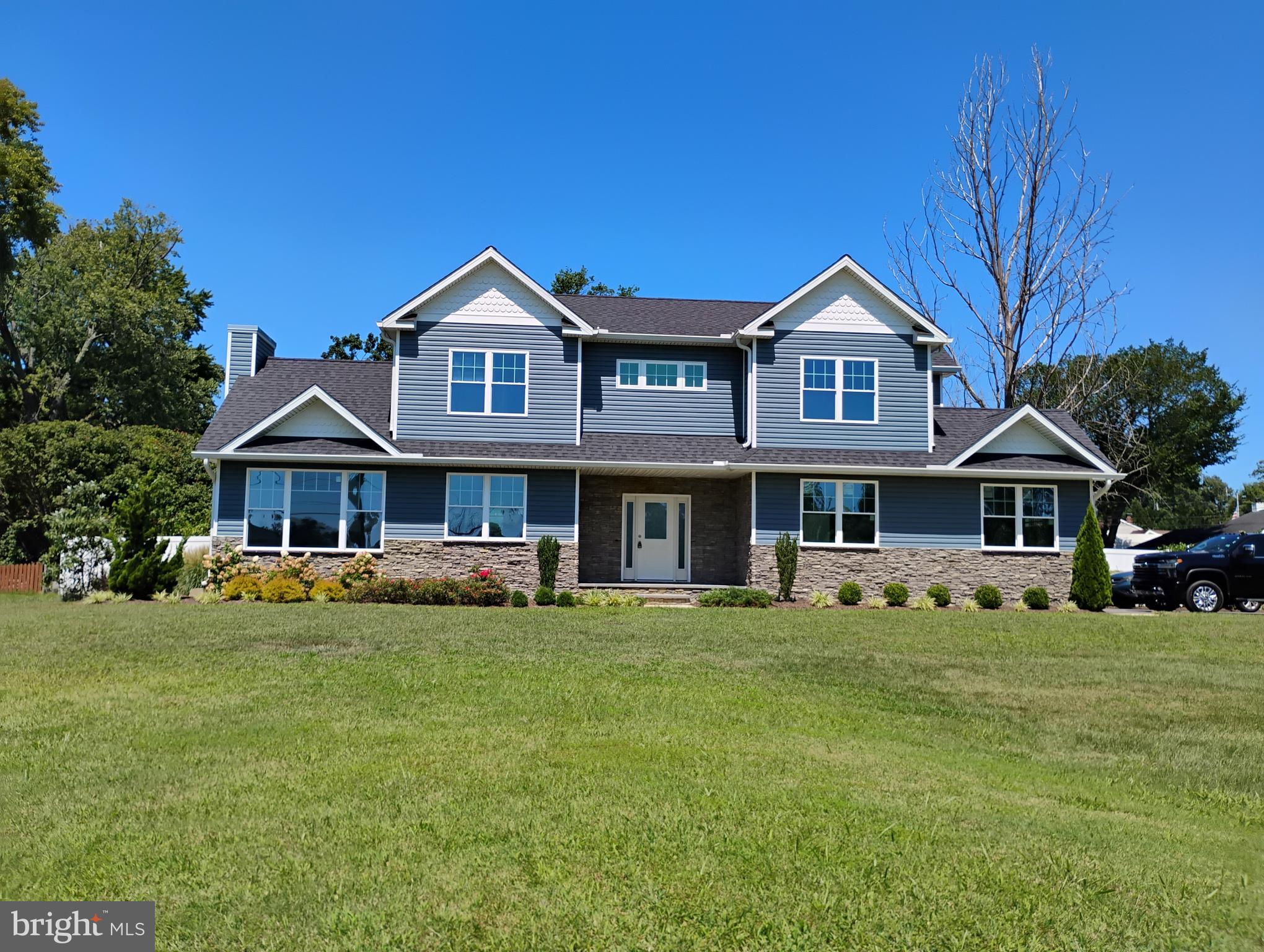 This home has it all for the outdoors people, a community beach within a few steps from this house.  A community boat ramp and pier is  a short walk away .  The front lawn is beautiful and spacious for outdoor fun.   The block building could be  a workshop, man cave or kids' play house or extra storage space.  This home is almost brand new, never been lived in.  The great room is  family room, kitchen and dining room all in one wide open  space with  cathedral ceilings.   Water view from the second floor bedrooms and limited view from the great room.  Primary bedroom has a luxurious bathroom and large walk in  closet.  The laundry  room is upstairs with front loading washer and dryer.  The over sized  two car garage has ample room for  a workbench  and storage.  The beautiful landscaping is a sight to behold.  You will feel that you are vacationing  at your own  resort.
