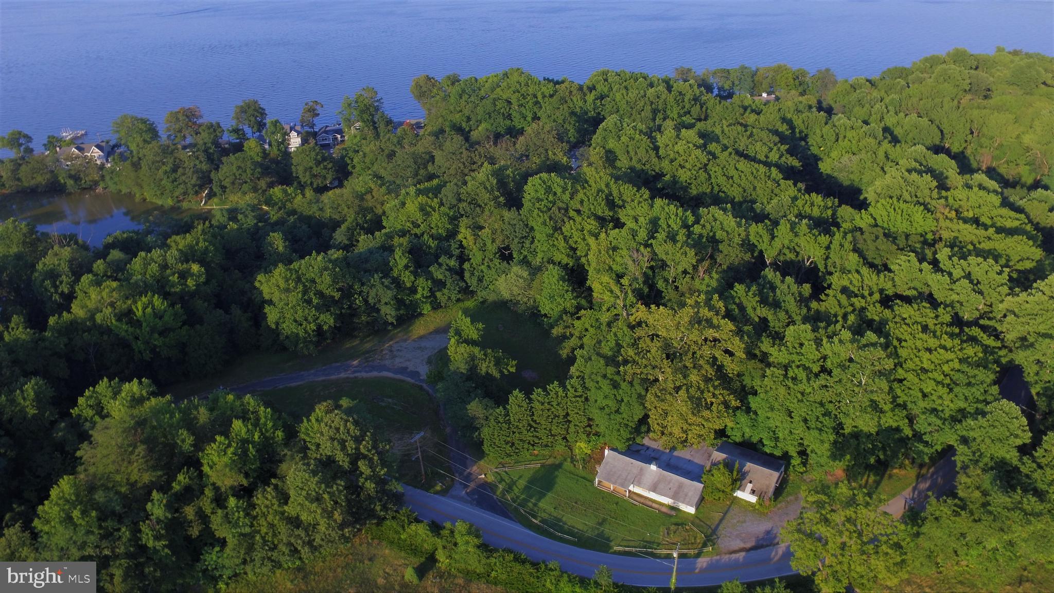 Development Opportunity in the beautiful neighborhood of Annapolis Roads - Waterfront Lots - Combination of three lots know as 2632, 2634 & 2636 Carrollton Rd - Parcel 2, Parcel 7 and Lot 12B combined to give you approximately   4.7acres of land with Water Frontage on Heron Lake   - Call you builder and get to work designing your dream home.  Annapolis Roads is a Special Taxing District and collects $985.30 for Parcel 2,  $313.79 for Lot 12B and $0.00 for Parcel 7. Possibility of subdividing these lots into 3 separate waterfront building sites of   1.5 acres each. NO access to the old building (Golf Club House) will be granted - it is in poor condition.