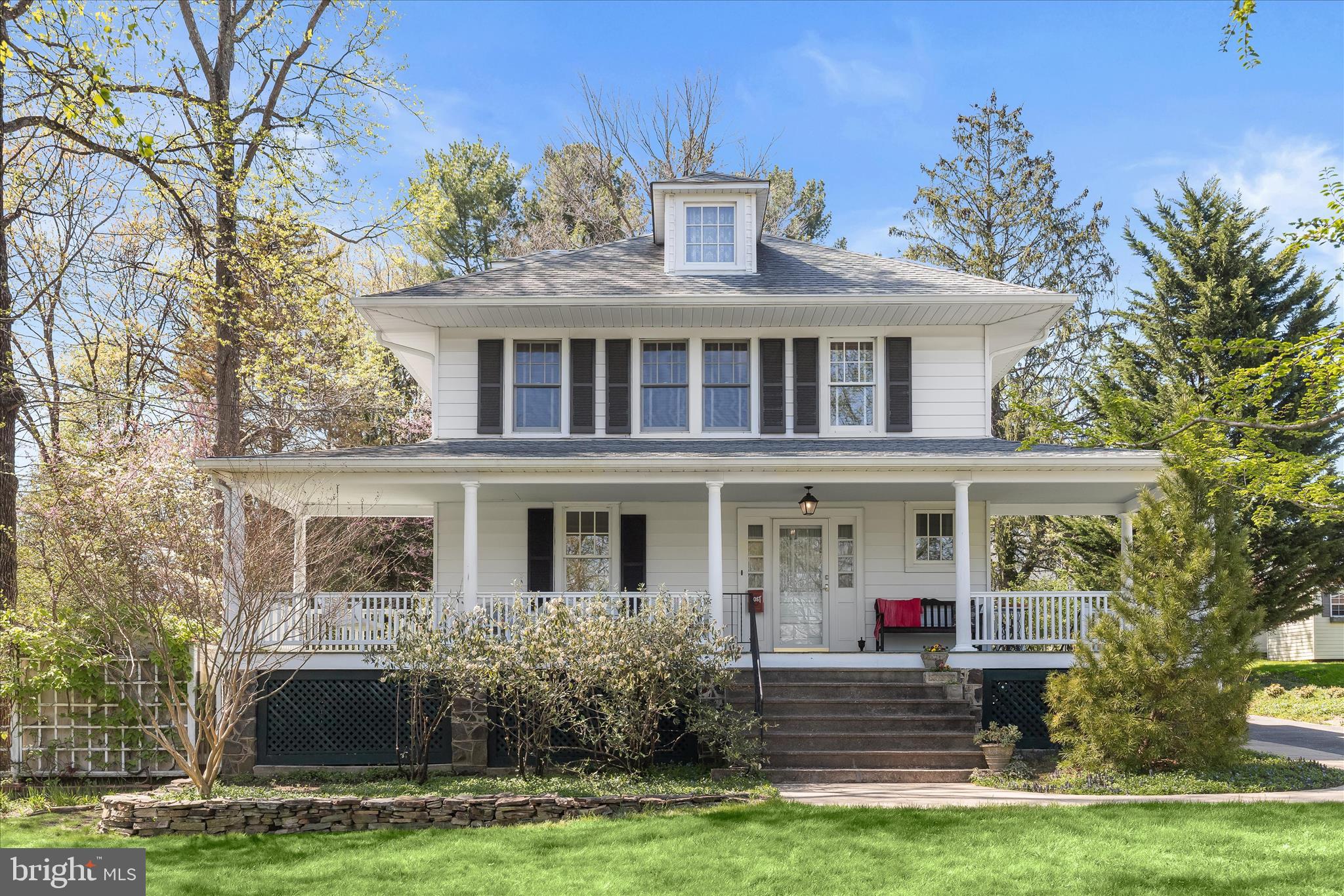 Welcome to 2216 Westchester Avenue, an elegant home rich in character and timeless charm. A welcoming covered wraparound front porch sets the tone for the refined interiors, where original hardwood floors, classic hardware, and thoughtful updates blend seamlessly throughout. Surrounded by lush, landscaped grounds, this home offers both beauty and functionality.
Inside, the spacious living room is filled with natural light and flows effortlessly into the formal living room adorned with classic moldings. The eat-in kitchen features granite countertops, ample cabinetry, and access to the laundry room, which leads to the spectacular rear yard. A full bath and convenient side entrance to the extended driveway complete the main level.
Upstairs, you’ll find four bedrooms, each with hardwood flooring. One bedroom features an attached sunroom overlooking the landscaped grounds, while another provides access to a floored attic, offering excellent potential for future expansion. The lower level includes a recreation room and abundant storage space.
Additional highlights include convenient driveway parking, a fenced backyard, and beautifully maintained landscaping. Notable updates include a hot water heater and air conditioning system (2023), gutters (2021), roof (2016), and washer, dishwasher, and oven replaced within the last five years.