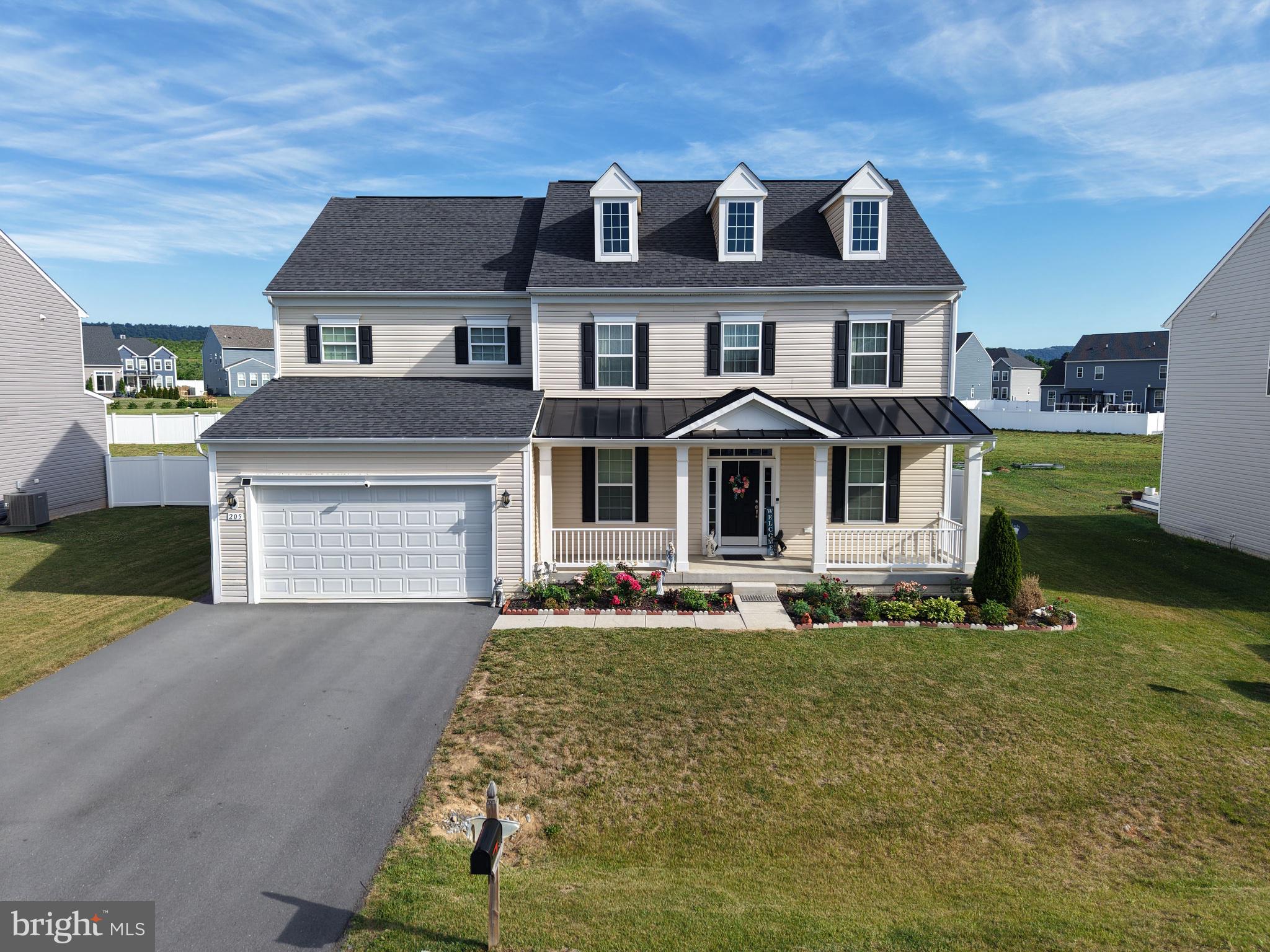 Welcome to 205 Voltaire Street in the sought after community of Springdale Farms. A beautifully maintained 4-bedroom, 3.5 bath home offering over three levels of thoughtfully designed living space and exceptional indoor-outdoor entertaining space. The main level features an open-concept floor plan. Enjoy a separate formal dining room, a comfortable sitting room, and a dedicated office space for flexibility for work, relaxation, and entertaining. Upstairs, you'll find four generously sized bedrooms, two full bathrooms, and the convenience of an upper-level laundry room. The newly finished basement expands the home living space with a large entertaining area, custom bar space, a full bathroom, bonus room, and additional storage area. Step outside to your own backyard oasis featuring a beautifully landscaped and fully fenced in yard, complete with a patio, outdoor kitchen, and pergola. This move-in-ready home offers the perfect blend of comfort, style, convenience in a desirable location.