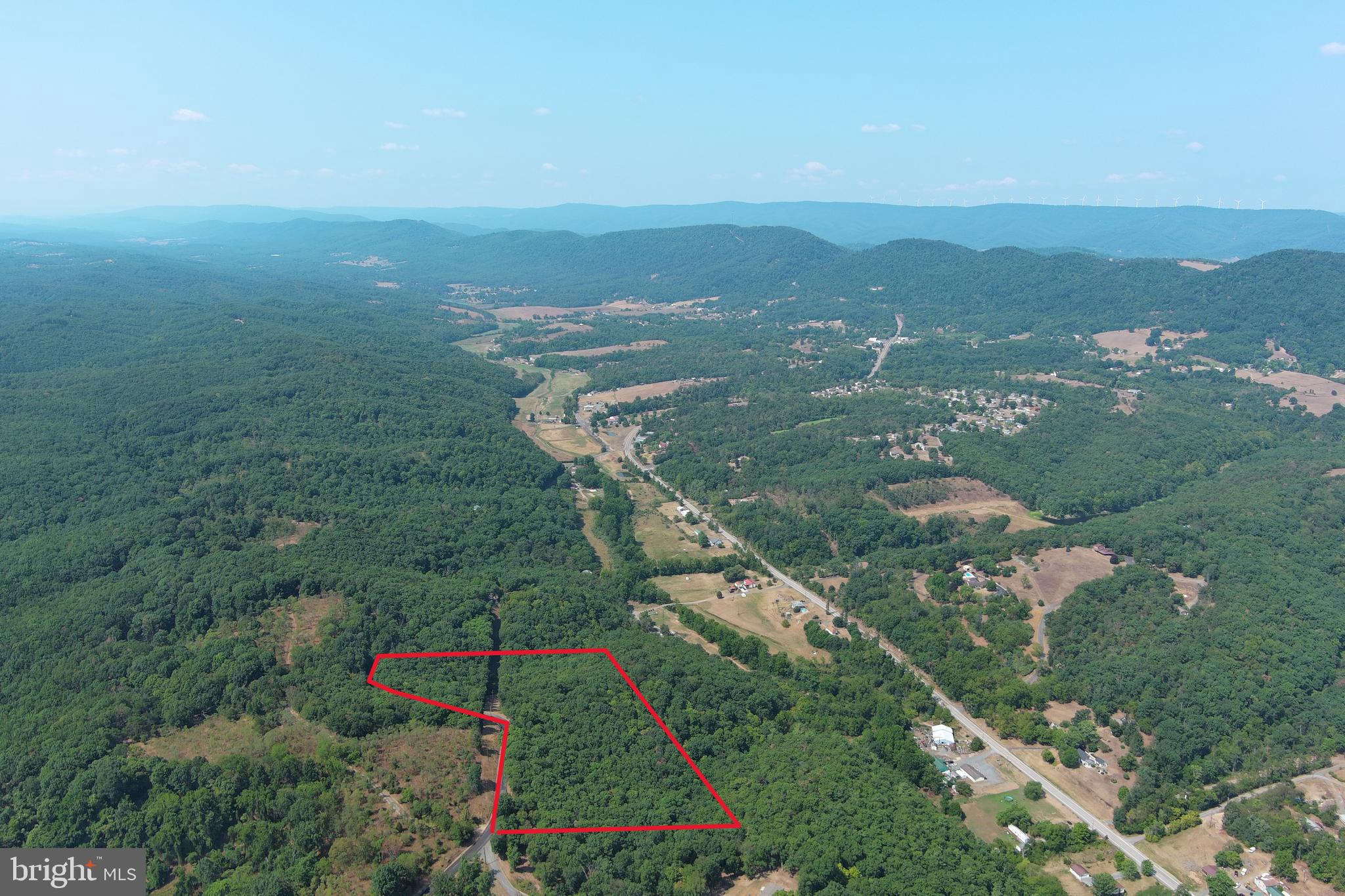 UNRESTRICTED.....NO RESTRICTIONS.....NO HOA.......NO RESTRICTIONS + NO HOA = NO PROBLEMS! 7.38 WOODED ACRES WITH EXTENSIVE PAVED ROAD FRONTAGE, DRIVEWAY INSTALLED TO BUILD/CAMP SITE, BIG MOUNTAIN VIEWS TO THE NORTH & WEST AND NO NEIGHBORS IN SIGHT! SAVE BIG $ ON INFRASTRUCTURE COSTS, YOU'RE ALREADY 10K AHEAD WITH THE DRIVEWAY AND THE ELECTRIC IS ONLY 100 FT FROM THE BUILD SITE! COVERED IN MATURE HARDWOODS WITH NICE ATV TRAIL, PLENTY OF ROOM TO HUNT & SHOOT......BIG VIEWS ARE HERE, JUST NEED TO CUT THE TREES AND WATCH THEM APPEAR.....PULL IN YOUR CAMPER, PERFECT HOME BASE FOR RV.....BUILD WHAT YOU WANT....BIG HOME, TINY HOME, MOBILE HOME....VERY PRIVATE, YET SUPER CONVENIENT LOCATION.....ONLY 10 MINUTES FROM KEYSER.  IF YOU AINT FIRST, YOU'RE GONNA BE LAST ON THIS ONE!