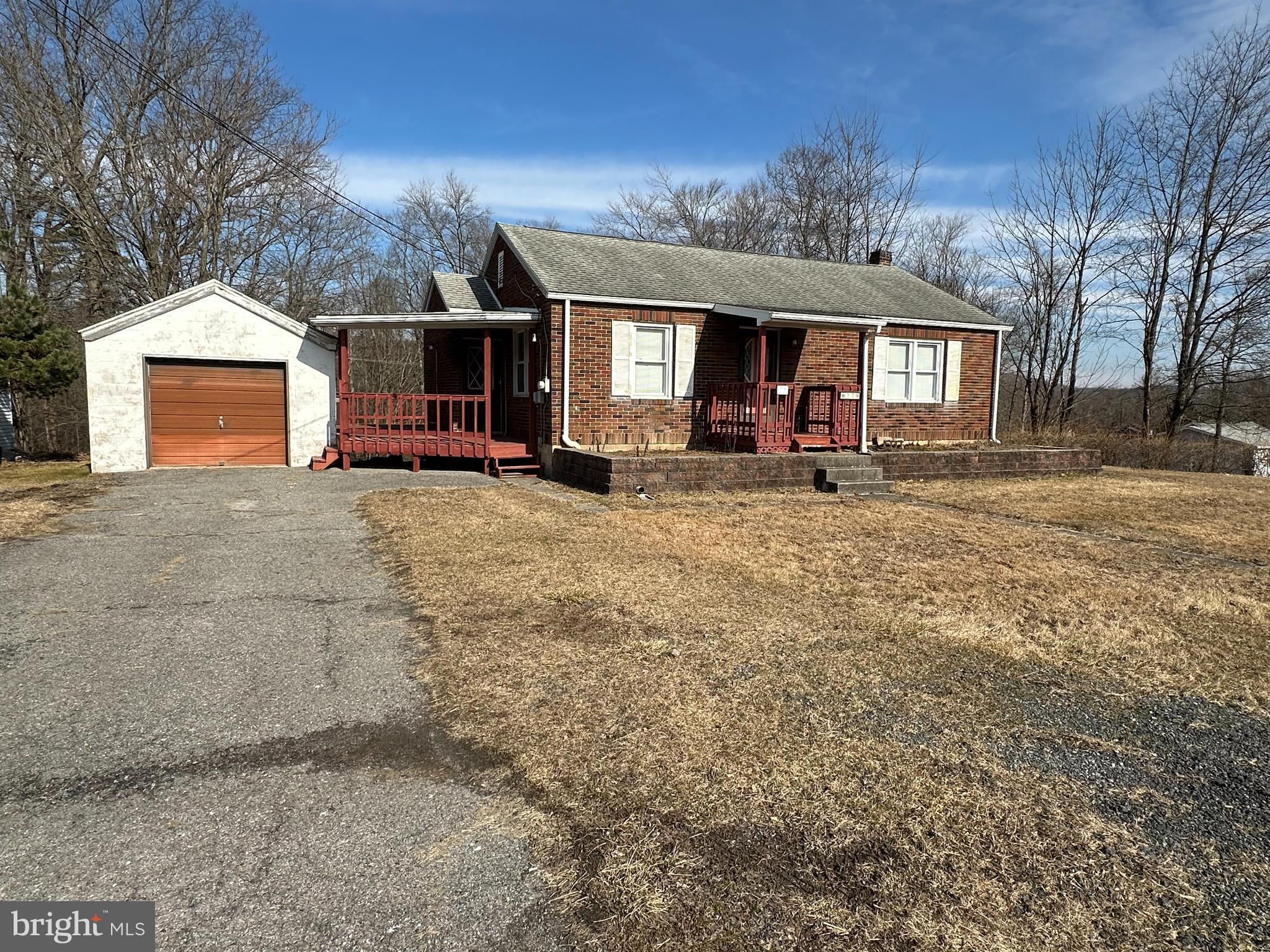 This well maintained ranch home located near all major routes is a quick ride to the Lehigh Valley.  It sits on just under an acre.  The exterior of the home has a wrap around deck that backs to woods.  A one car garage is excellent as a work shop or parking.  The main living floor has two large bedrooms with double closets in each.  The eat in kitchen has plenty of counter space and newer appliances.  The lower levels features a den/office space with an exit to the backyard.  This level also has a large finished room that could double as a rec room or a third bedroom.  Laundry is located on the lower level and has an oversized utility sink.  Schedule today!!