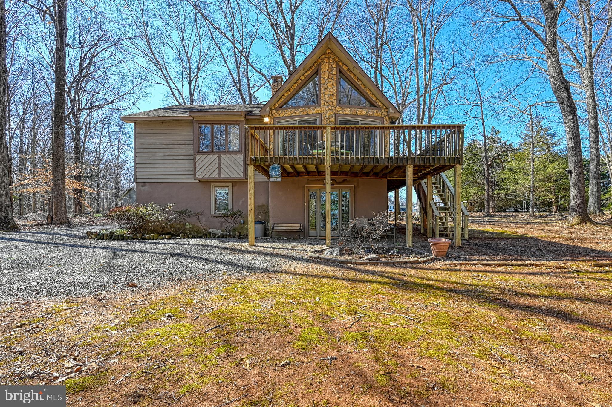This charming  4 bedroom 3 bath home is being sold fully furnished. Located on the public side of Lake Anna and nestled on a partially wooded lot with a large backyard enjoy all  the lake and this area have to offer.  Relax by the firepit  or take in the views from the deck or the  great room with its vaulted ceilings and Large windows.  Just a short drive to Dining, Breweries, Wineries, Shopping and Local farm stands or Go to some of the great Restaurants and shops on the lake with just a short boat ride   The POA is optional for this property but does include lake access if you choose to join. this home has been a full time residence but would make a great vacation rental and could easily be separated into 2 units for someone looking to earn some income while still using their lake house.  The hot tub does convey with the sale of the property but will require repair.