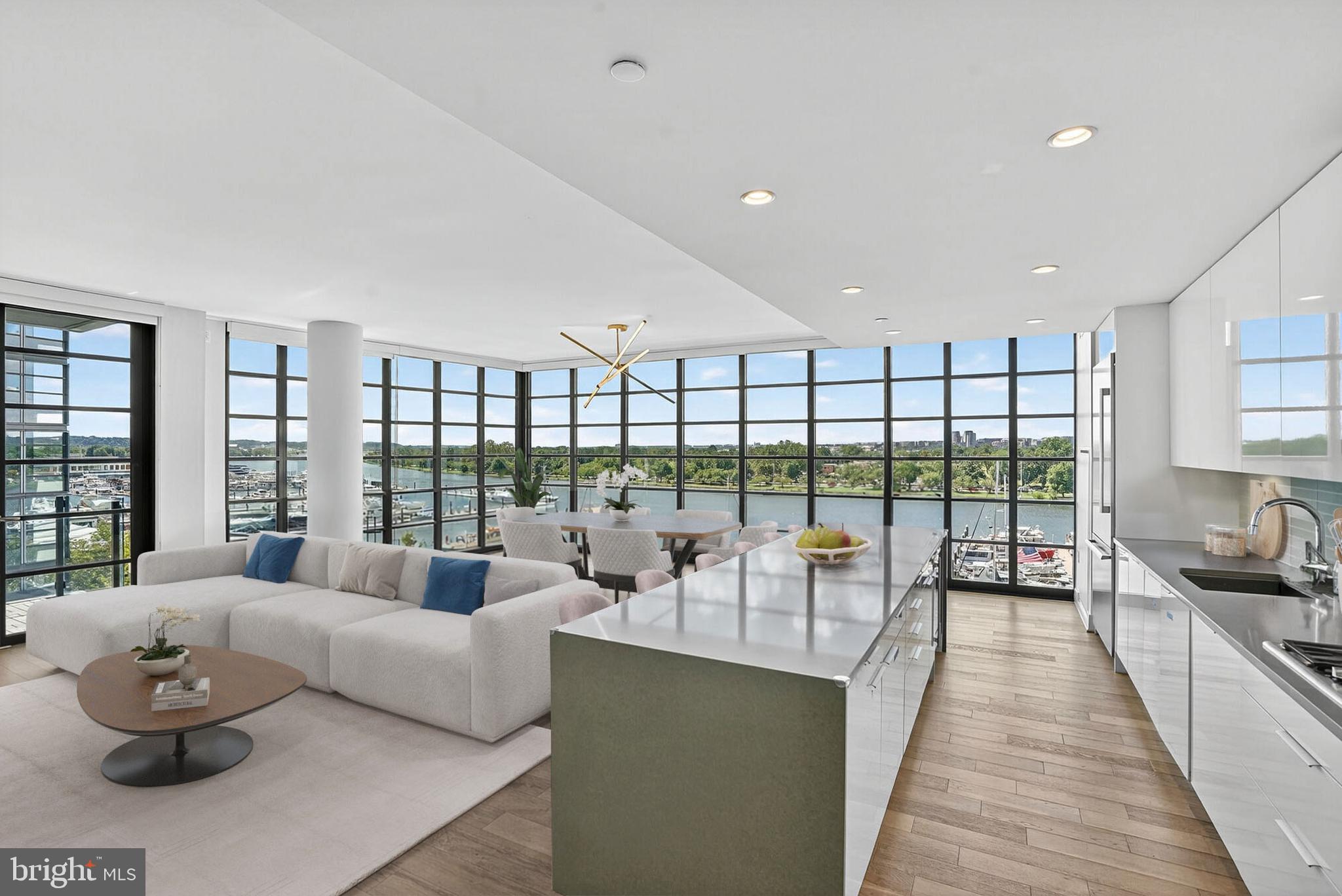 Welcome to VIO Unit 509, where refined living meets the vibrant energy of The Wharf. This exceptional 3-bedroom, 2.5-bath residence offers an immersive waterfront lifestyle, with two private terraces and sweeping Potomac River views from every window—placing you at the center of one of DC’s most sought-after destinations. Arrive via a private elevator gallery, setting the tone for a home designed for both elegance and ease. Inside, expansive living and dining spaces are framed by floor-to-ceiling windows that capture the rhythm of the marina, passing boats, and the lively promenade below. Whether entertaining or unwinding, the connection to the waterfront is ever-present. The chef’s kitchen is thoughtfully appointed with premium appliances, custom cabinetry, and a generous island—perfect for gathering before stepping out to enjoy the Wharf’s acclaimed restaurants, waterfront concerts, and boutique shops just moments from your door. The primary suite serves as a serene retreat, complete with a sitting area, private terrace, and a spa-inspired marble bath featuring dual vanities, a soaking tub, and a glass-enclosed shower. Two additional bedrooms offer flexibility for guests or a sophisticated home office, complemented by a well-appointed full bath. Two secure parking spaces in the gated & electric vehicle charging equipped garage add to the convenience while access to exclusive building amenities including a state-of-the-art gym and stunning resort-style pool overlooking the Potomac make living in VIO unit 509 truly effortless . Perfectly positioned to embrace the best of waterfront living, Unit 509 delivers a rare opportunity to experience sunrise coffees by the river, sunset strolls along the pier, nightly shows at The Anthem and Arena Stage Theater, plus the unparalleled shopping and dining of The Wharf all in one remarkable location.