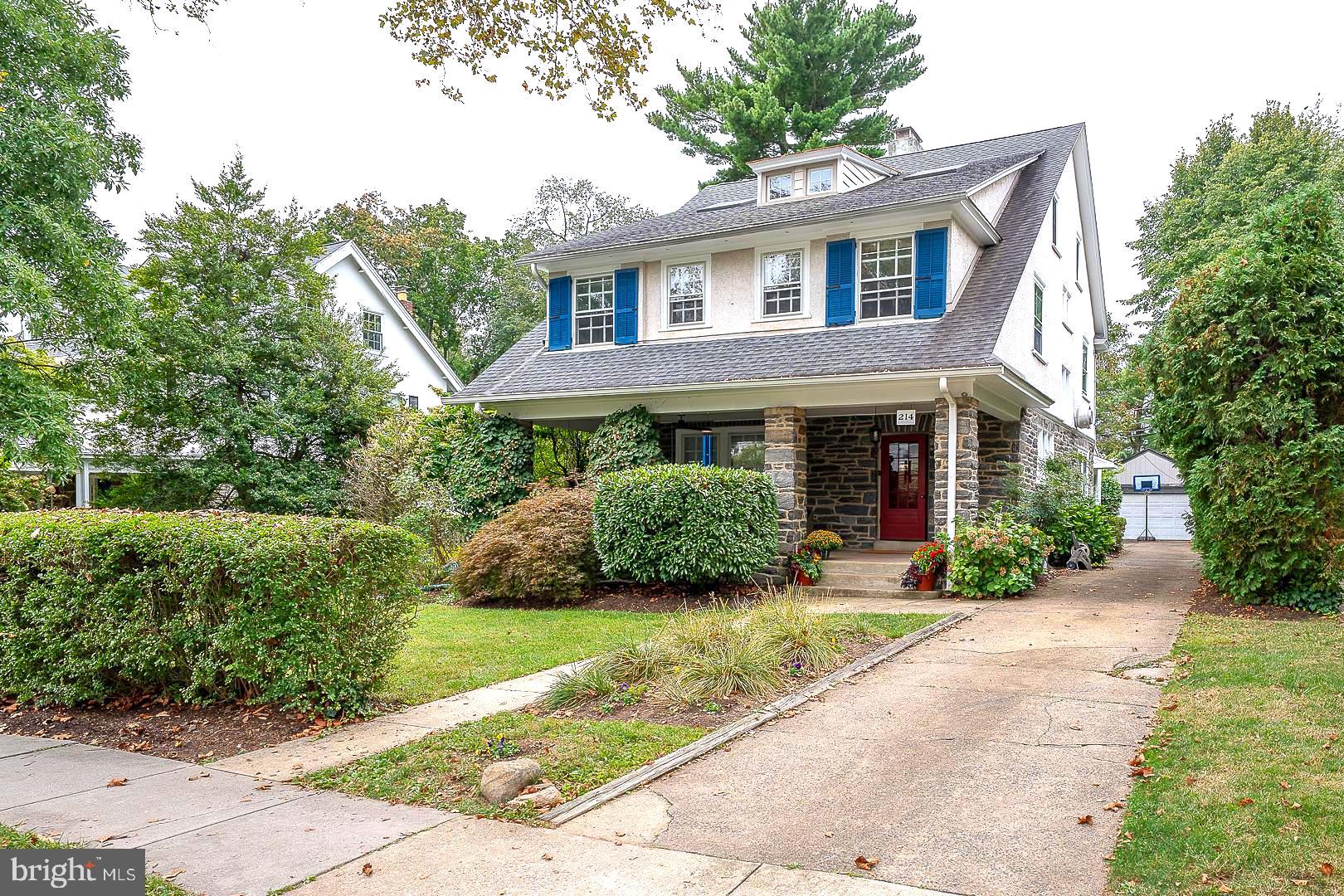 Fabulous Arts&Crafts style stone, six bedroom, three and one half bath colonial with open, covered front porch, private drive and detached two car garage. This house is very well-located within one of the most cherished and sought after 'walk-to' family neighborhoods on the Main Line, and it is beautifully redone. Quiet leafy streets with sidewalks and street lights, beautiful houses, both a preservation meadow and a community garden serve the neighbors.  Proximal to LMHS's athletic fields, tennis courts and track, all just across Kent Road. This listing also backs directly to the very special community garden and greenspace the neighborhood enjoys, adding a beautiful natural setting, additional privacy and tranquility to the long list of benefits of life at 214 Kent Road.

Walk up to the inviting covered front porch and front portico.  Front door opens into the gracious entrance hall foyer, with transverse stair, hardwood floors, pretty leaded windows and flows into the formal reception rooms, and to the kitchen.  Dining and living rooms share the open floor plan, and have beautiful brick fireplace hearths, hardwood floors and bright, sunny windows. Living room opens beautifully to the redone island kitchen with seating and granite countertops, undermount sink and stainless gas range/range hood.  The kitchen opens beautifully to the adjacent sunny family room with powder room alcove, coat and storage closets, and sliding back door to the rear yard, garage and community garden path.  Stairs from Foyer up to second floor landing.

Second floor landing has full laundry closet, four bedrooms and two full bathrooms. Bedroom #1 has ensuite private full bath. Family bedrooms 2,3&4 share the second, full hall family bathroom. These three family bedrooms are well-proportioned, and have ample closets, bright windows and pretty hardwood floors. Steps up to third floor.

The third floor has been completely redone by the present owners into a full owners' bedroom suite, with luxe custom, ensuite bathroom, with standing tub and separate stall shower, twin bowl vanity and private WC. Dual double closets with built-in shelving, organizing and hanging systems and lighting. Suite has an owners' retreat studio with skylight in addition to a full, separate bedroom.

Lower level is full, unfinished, with storage rooms, bilco door and mechanicals.

Walking distance to SEPTA (10 mins) and Suburban Square (10 mins). The best that Wynnewood, Narberth and Ardmore have to offer for markets, shopping, brewpubs, restaurants and convenience.