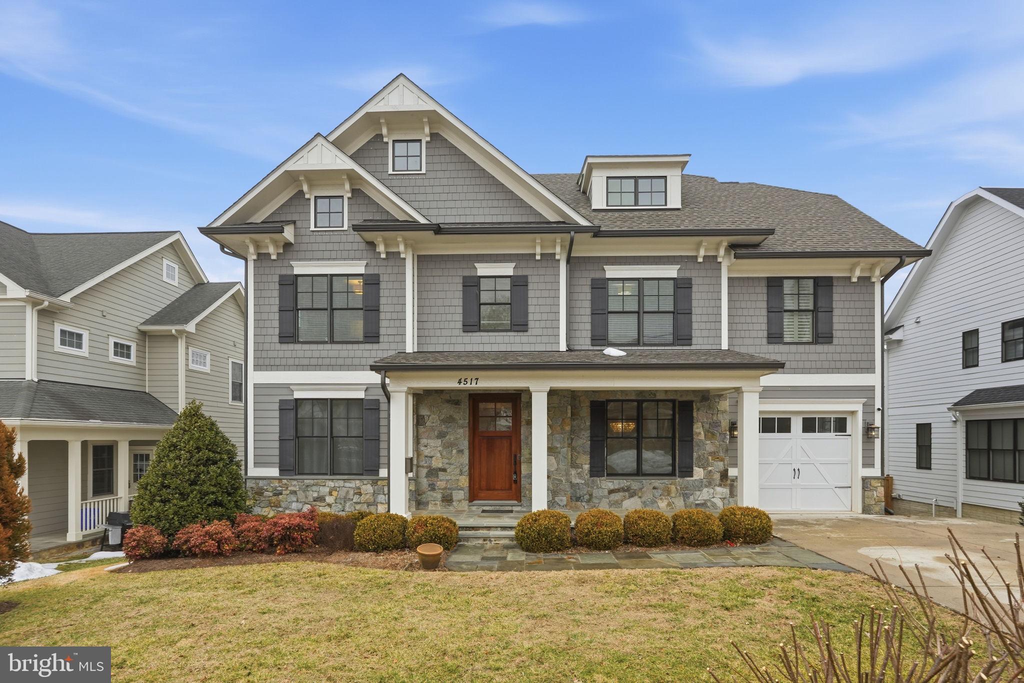 This exceptional Arts & Crafts residence, crafted by the renowned Douglas Construction, offers four beautifully finished levels of thoughtfully designed living space, blending timeless architecture with elevated modern comfort. Generous room sizes, intentional sightlines, and meticulous detailing define every level of the home. Upon entry, the foyer sets the tone, flanked by a private study ideal for working from home and a refined dining space perfectly suited for both formal entertaining and intimate dinners. The main living area unfolds into a warm and inviting family room, featuring custom built-ins and a striking stone-accented gas fireplace, an ideal gathering space for everyday living and special occasions alike.
The adjacent kitchen is a true showpiece, designed for both function and style. Highlights include a n eat-in marble island, Wolf range with pot filler, Sub-Zero refrigeration, and beautifully tailored cabinetry. A discreetly located mudroom enhances daily convenience with custom cubbies, bench seating, a walk-in pantry and separate walk in coat closet. The primary suite offers a serene escape with coffered ceilings, a spacious walk-in closet and a spa-caliber bath.  Four additional spacious en-suite bedrooms and  dedicated laundry room completes the level. The uppermost level provides exceptional flexibility with a large bedroom, full bath, and an open loft space ideal for a fitness studio, creative workspace, or secondary office. The fully finished lower level extends the home’s versatility, featuring an additional bedroom and full bath, an expansive recreation room, and a separate space well-suited for a media room or playroom.
Outdoor living is equally impressive, with a rear deck that leads to a flagstone patio surround by a fully fenced backyard, perfect for both entertaining and quiet relaxation. Distinctive in every way, this home stands apart, offering purposeful design, premium finishes, and refined craftsmanship throughout. Tucked into a charming, park-adjacent neighborhood with nearby trails, the location offers seamless access to Metro, major commuting routes, and the vibrant dining, shopping, and cultural scene of downtown Bethesda—all just moments away.