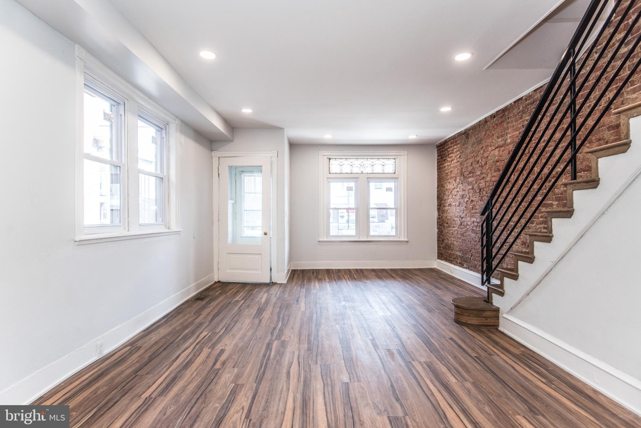 Newly Renovated Home. Amazing home living in the Wyoming neighborhood of Philadelphia. As you enter this home you will see how spacious and airy the property feels being an open concept layout perfect to host guests. The first floor also has 1 full bathroom and access to the rear yard. The exposed brick pairs brilliantly with the color design and iron railing.  The living room easily flows into the dining area and kitchen which has all a modern design white shaker cabinet, appliances, granite counter top, and recessed lighting. This house is turn key with all of your kitchen appliances included! Through the kitchen there is easy access to the rear yard to host all of your summer barbecues in the yard! Large windows let in natural light at your leisure, and built-in ceiling fans throughout ensure your comfort. The bathrooms are elegantly designed, blending beauty and comfort. Upstairs has 4 large bedrooms and an additional full bathroom.  The basement is unfinished but has enough headroom to finish it if you so desire. The basement also features hookups to laundry.  This house wont last long, schedule your tour and come check it out!