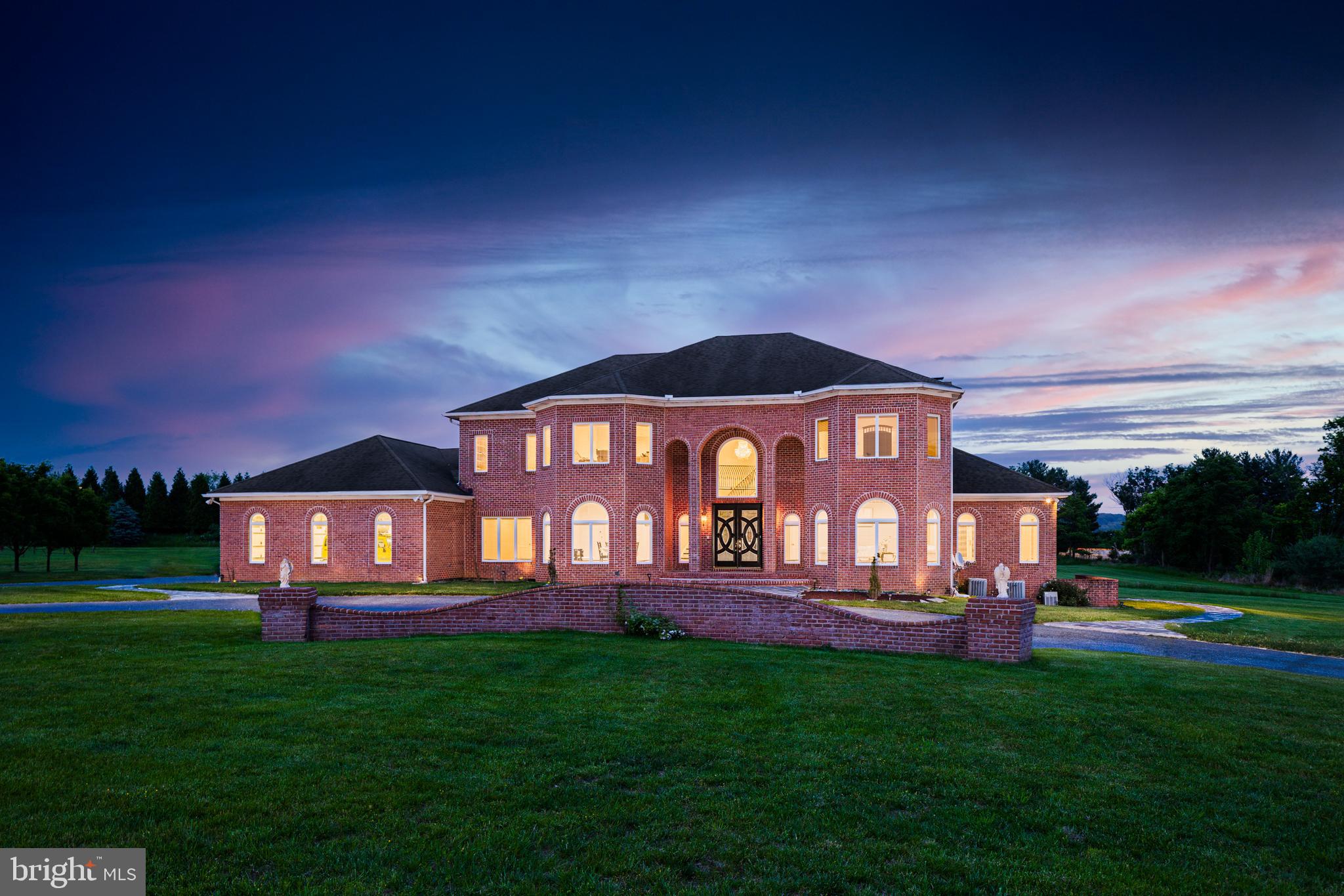 IMPRESSIVE ALL BRICK COLONIAL RESTING ON A 4.65 ACRE LOT WITH OVER 5,300 SQ. FT. OF LUXURY LIVING SPACE!  Features include a traditional floor plan with a dramatic 2 story foyer with a curved staircase, an incredible eat-in gourmet kitchen built for a Chef with Viking appliances, granite counters, an abundance of cabinet space, a comfortable family room with a double sided wood fireplace leading to the sunroom, 5 bedrooms and 4.5 baths including an expansive Primary suite with a sitting area with a gas fireplace & wet bar, an oversized walk-in closet, and a luxury spa bath with a spacious glass enclosed shower and a whirlpool tub, a full basement that can be finished to add more living space, an impressive rear patio that overlooks the level rear yard with plenty of space to add a pool if desired, plenty of parking with a 4 car garage and circular driveway, whole house audio system, and a Pura ultra violet water purification system.  Prime location - minutes from Hayfields Country Club, Oregon Ridge, Hunt Valley Towne Center, and commuter routes!