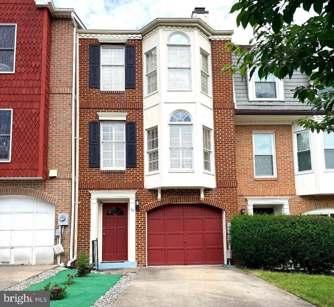 Nestled in the charming community of The Abbey, this delightful Colonial townhouse exudes warmth and character. Thoughtfully designed living space, featuring two spacious bedrooms, den space and four bathrooms, ensuring comfort and convenience for all. Step inside to discover a harmonious blend of modern functionality. The inviting family room, complete with a cozy quartz fireplace, pairs seamlessly with the eat-in quartz kitchen, which boasts a quartz island and dining space perfect for gatherings. Crown moldings enhance the home's sophisticated ambiance, while hardwood and luxury vinyl plank flooring add a touch of luxury throughout. The exterior is equally captivating, featuring classic brick and vinyl siding, complemented by charming bump-outs and exterior lighting. Enjoy serene moments on the deck. This townhome includes an attached garage and driveway parking. Convenience is key with community amenities such as basketball, tennis courts, and playgrounds.  Experience the unique craftsmanship and inviting atmosphere of this exceptional property, where every detail has been designed with comfort in mind. Don't miss the opportunity to make this charming townhouse your new home!