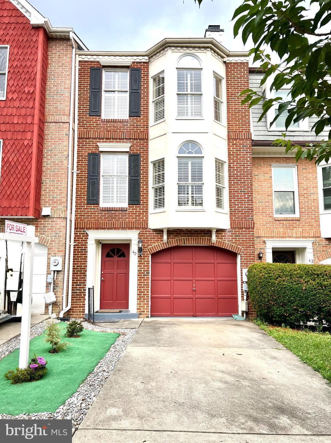Nestled in the charming community of The Abbey, this delightful Colonial townhouse exudes warmth and character. Thoughtfully designed living space, featuring two spacious bedrooms, den space and four bathrooms, ensuring comfort and convenience for all. Step inside to discover a harmonious blend of modern functionality. The inviting family room, complete with a cozy quartz fireplace, pairs seamlessly with the eat-in quartz kitchen, which boasts a quartz island and dining space perfect for gatherings. Crown moldings enhance the home's sophisticated ambiance, while hardwood and luxury vinyl plank flooring add a touch of luxury throughout. The exterior is equally captivating, featuring classic brick and vinyl siding, complemented by charming bump-outs and exterior lighting. Enjoy serene moments on the deck. This townhome includes an attached garage and driveway parking. Convenience is key with community amenities such as basketball, tennis courts, and playgrounds.  Experience the unique craftsmanship and inviting atmosphere of this exceptional property, where every detail has been designed with comfort in mind. Don't miss the opportunity to make this charming townhouse your new home!