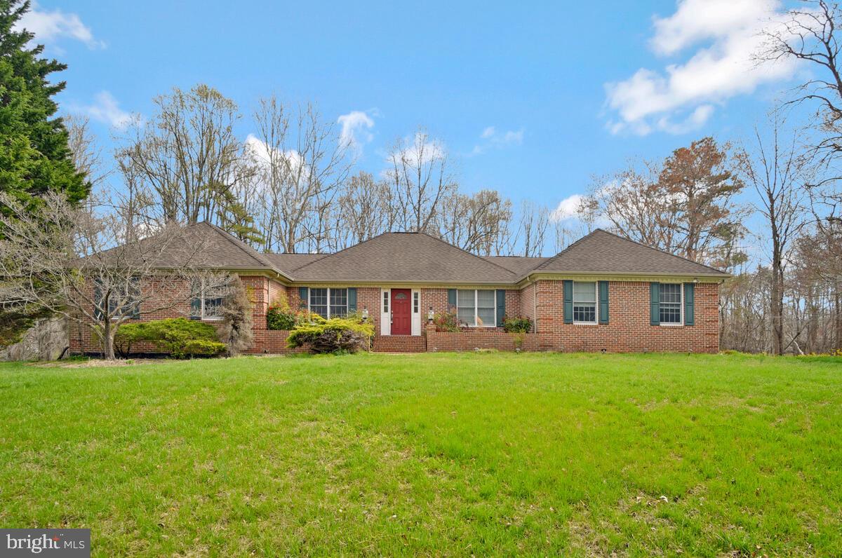This wide‑open brick rambler sits on a fabulous private homesite and is ready for immediate possession! Recent updates include brand‑new carpet, refreshed appliances, updated countertops, and fresh paint throughout. The light‑filled, open floorplan offers plenty of room to spread out—making this a warm, welcoming place to call home. The main level features a spacious owner’s suite complete with a walk‑in closet and a private bath offering a soaking tub, separate shower, and double sinks. All additional bedrooms are generously sized as well. The open living room is a standout with its cathedral ceiling, cozy gas fireplace, and abundant natural light. Additional interior highlights include hardwood flooring, crown molding, and chair railing for an added touch of charm and character. Step outside to the oversized back deck—an ideal spot for summer gatherings, grilling, or simply enjoying the peaceful surroundings.
Swanson Creek Landing offers an easy commute to Washington D.C., Joint Andrews, and PAX River, and is just a short drive to town for all your shopping and dining needs. Outdoor enthusiasts will love being close to the Patuxent River, complete with a community boat ramp for weekend adventures.