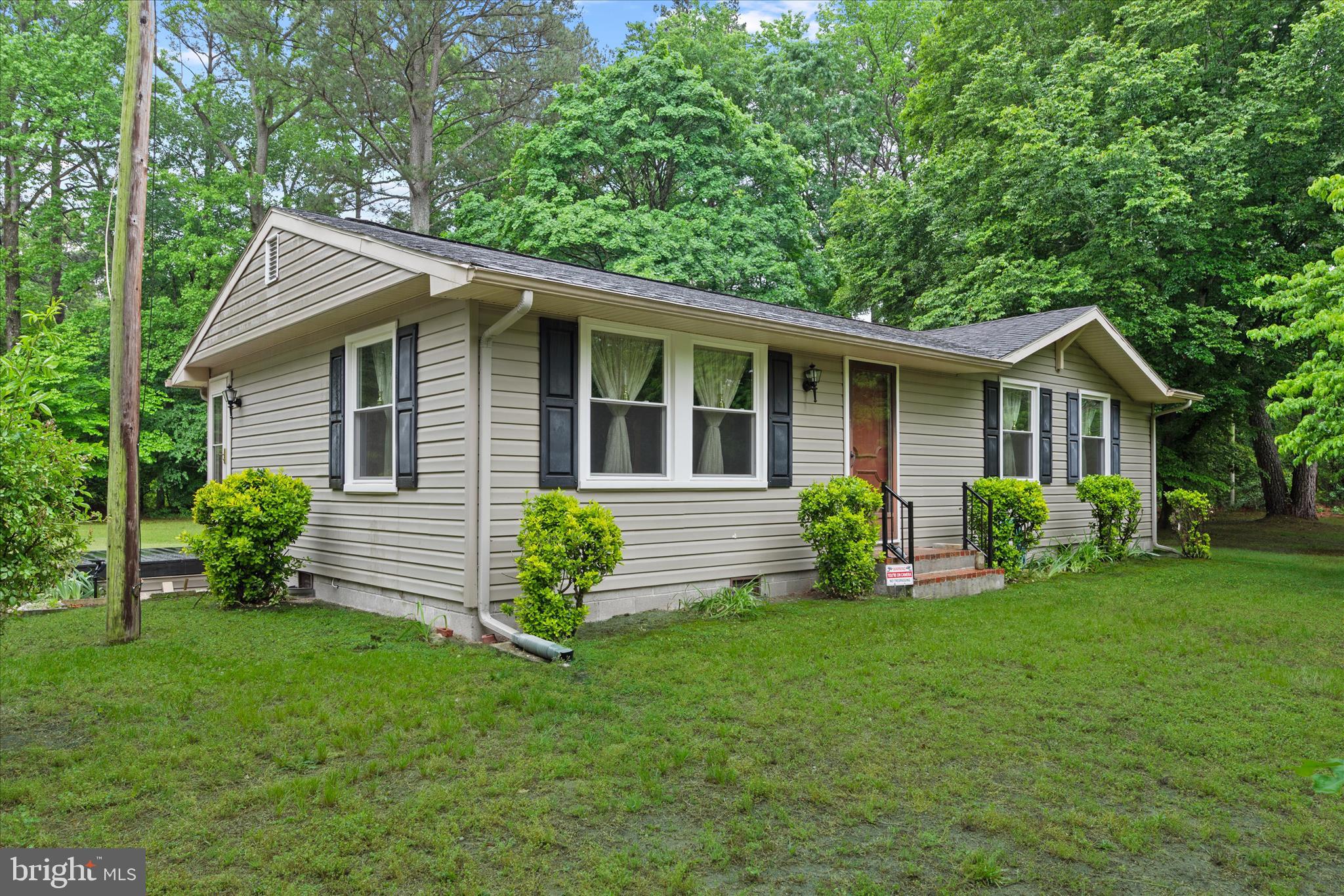 Welcome to this charming 3-bedroom, 1.5-bath ranch-style home nestled on a private 0.59-acre lot in Eden, MD. Surrounded by mature trees and peaceful outdoor space, this well-maintained property offers the perfect blend of quiet country living and convenient access to Salisbury, shopping, dining, and area amenities. Inside, you’ll find a comfortable single-level layout featuring a spacious living area, rustic wood accents, entry-level bedrooms, and a functional kitchen with island cooktop, wall oven, breakfast area, ample cabinetry, and stainless steel appliances. The home also offers a dedicated laundry area, abundant natural light, and a warm, inviting atmosphere throughout. Over the years, numerous improvements have been completed including vinyl siding, replacement windows, updated HVAC and heat pump systems, crawlspace remediation and encapsulation, updated appliances, septic servicing, water softener installation, roof repairs, and more — providing added value and peace of mind for the next owner. Outside, enjoy the large yard, patio area, detached storage shed, gravel driveway, and plenty of room for gardening, recreation, entertaining, or simply relaxing in the peaceful Eastern Shore setting. Whether you’re searching for a full-time residence, starter home, investment property, or private retreat near Salisbury, this affordable Wicomico County home offers comfort, character, and outdoor space in a desirable rural location.

** John Deere riding lawn mower included. Property is being sold as-is. **