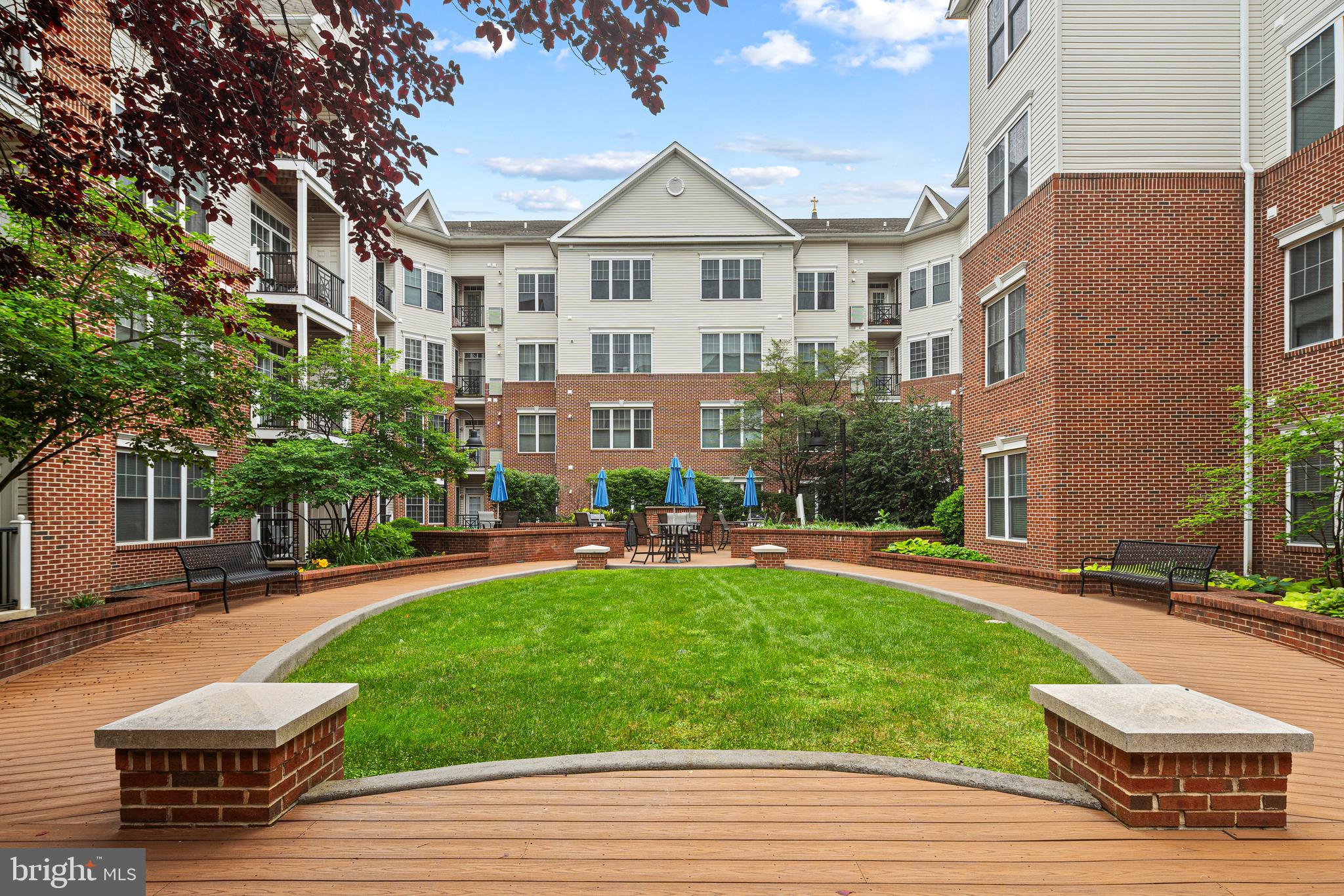 Discover easy, maintenance-free living at 200 W. Elm Street, Unit 1108. This desirable Dresher floor plan offers a spacious and inviting layout designed for both everyday comfort and entertaining. The well-appointed kitchen showcases Corian countertops, a breakfast bar for casual dining, and black appliances, all opening to a sun-filled living and dining area.

A versatile bonus room provides the flexibility to fit your lifestyle, whether used as a home office, reading nook, nursery, or extra storage space. Enjoy the convenience of an in-unit washer and dryer, and unwind on your private balcony accessed through sliding glass doors.

The home includes one deeded underground garage parking space, with ample guest parking available for visitors. Residents have access to exceptional community amenities, including a swimming pool, fitness center, and outdoor gathering areas complete with grilling stations.

Ideally situated near the Valley Forge and Schuylkill River Trail systems, this location places you within walking distance of Conshohocken's vibrant dining, shopping, nightlife, and public transportation options. King of Prussia Mall, major highways, and Center City Philadelphia are all just a short drive away, making commuting and entertainment effortless.