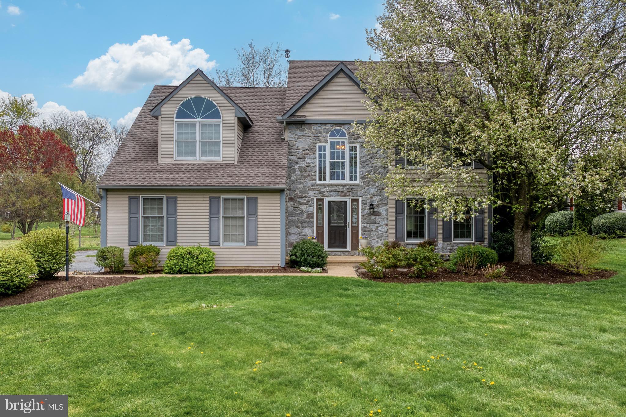 Welcome to this beautifully maintained 4-bed, 2.5-bath colonial offering 2,330 sq ft of light-filled living space on a spacious ½-acre lot. The bright 2-story foyer leads to formal living and dining rooms with hardwood floors, crown molding, and chair rail accents. The updated eat-in kitchen features Corian counters and backsplash, stainless steel appliances including gas range, and tile flooring. Adjacent is a cozy family room with Brazilian teak floors and a wood-burning fireplace. Upstairs, all four bedrooms feature newer luxury vinyl plank flooring.  The primary suite includes a walk-in closet and an en-suite bath complete tiled floor, dual sinks, walk-in shower and jetted soaking tub. The second-floor laundry room adds everyday ease, equipped with a utility sink and located just steps from a full bath with tiled floor and tub/shower combo. Enjoy outdoor living on the expansive deck with retractable awning—perfect for dining and entertaining. Have peace of mind with updated natural gas mechanicals, including newer high-efficiency furnace and tankless water heater, newer architectural shingle roof, whole house water filter + Reverse Osmosis system for drinking water and ice maker. Schedule your private showing today!