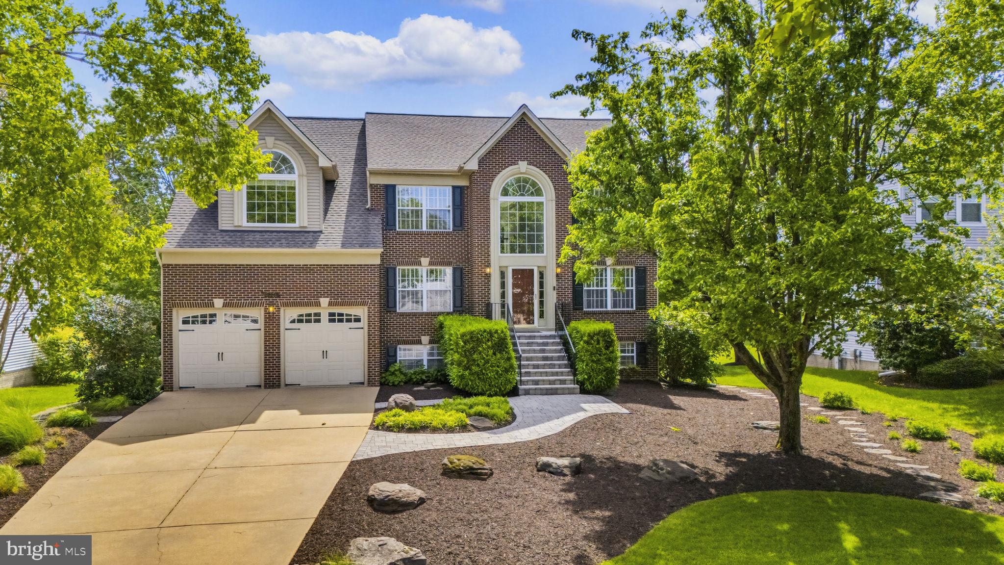 Stately brick-front Colonial located in the highly sought-after water-privileged community of West River Estates. This absolutely gorgeous home offers exceptional space, charm, and amenities throughout. The beautifully appointed kitchen features granite countertops, double wall ovens, a large center island with built-in cooktop, and ample cabinetry. French doors open to a bright all-season sunroom with dual access to the deck and the dramatic two-story family room with a wood-burning fireplace. An additional set of French doors leads to a private library with custom built-ins, while another separate sunroom provides the perfect spot for morning coffee or relaxing with a book. The main level also includes formal living and dining rooms, along with hardwood flooring throughout most of the level. Upstairs offers four spacious bedrooms and two full baths, including a luxurious primary suite with dual walk-in closets and a spa-like bath featuring a soaking tub and separate shower. Hardwood flooring continues throughout the entire upper level. The finished lower level includes a large recreation room with built-ins and a spacious office that could easily serve as a fifth bedroom (no closet). Step outside to your own private backyard oasis featuring a large deck, beautiful screened gazebo ideal for entertaining, extensive hardscaping, a level rear yard, and a storage shed. Enjoy a short walk to the community playground and pier. Conveniently located for an easy commute to Annapolis, AFB, and Washington, D.C. Additional updates include a roof less than six years old and newer HVAC systems. A must-see home!