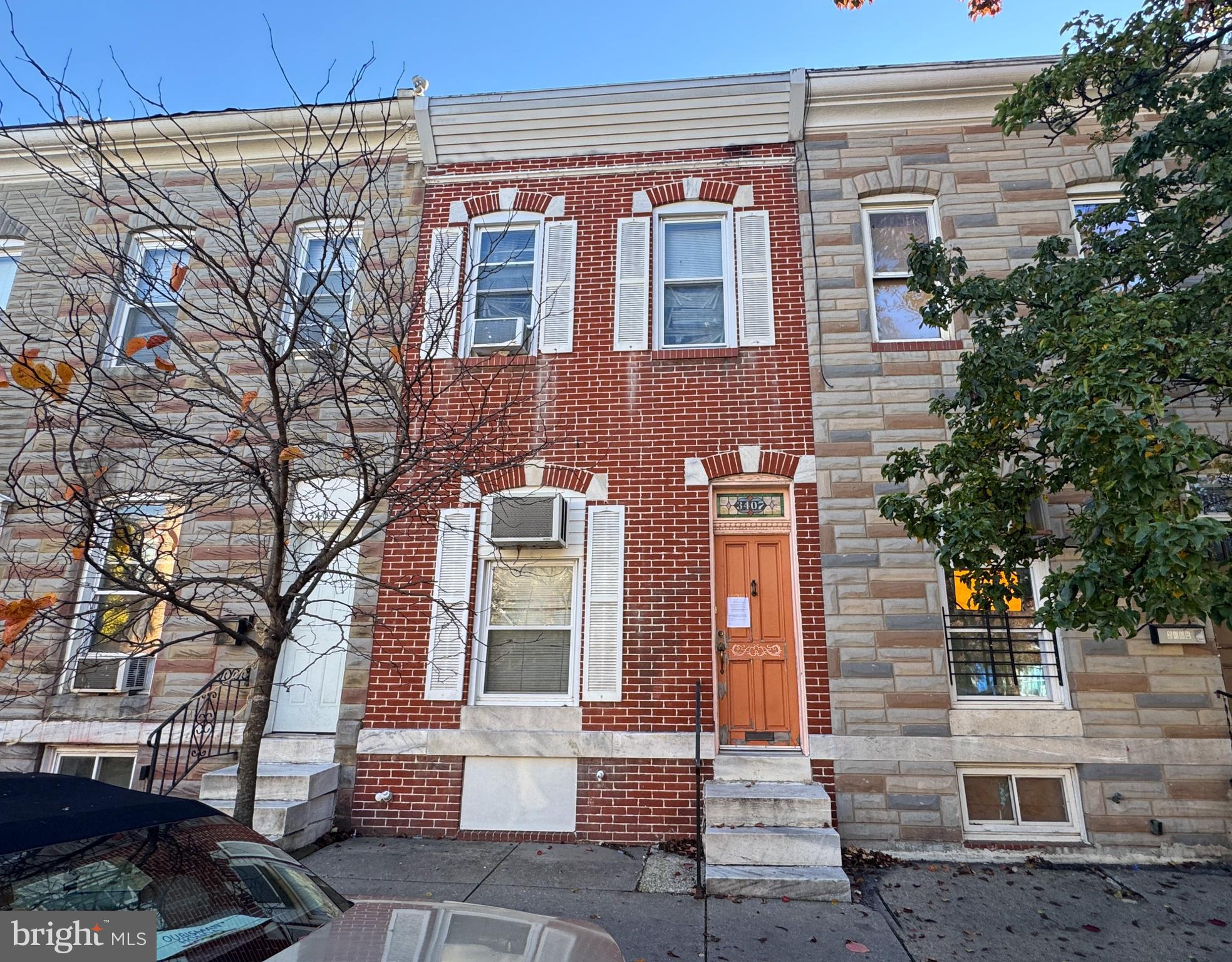Discover an exceptional investment opportunity in the heart of Baltimore Highlands! This colonial townhouse, built in 1900, features a solid brick exterior and spacious 1,560 square feet of interior space. enhanced by natural light streaming through double-pane windows and a skylight. The main level has an open flow plan with laminate plank flooring from the living room to the dining area. The kitchen with wood cabinets and appliances has ample space to cook for culinary enthusiasts. With two bedrooms and a full bathroom equipped with a tub shower that offers relaxation and privacy, this home is ready for immediate occupancy or future rental-income. The full, unfinished basement offers tremendous potential for additional living space or storage, with interior access and walkout stairs leading to the backyard. Imagine transforming this area into a cozy den or a home office, significantly increasing the property's value. Outside, enjoy the convenience of sidewalks and streetlights in a friendly neighborhood. The deck provides a perfect spot for outdoor relaxation or entertaining guests. Don't miss out on this opportunity to secure a valuable asset in a thriving community!
