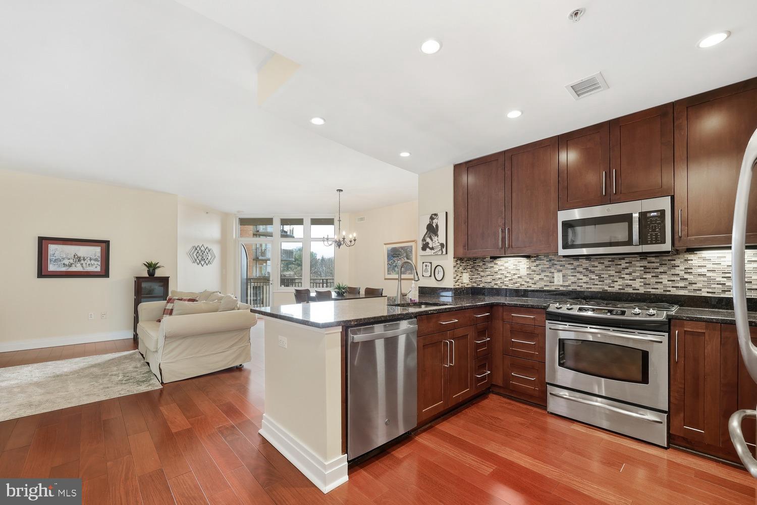 Offer due Monday May 25th at 3pm.  Beautifully appointed condo in the heart of Tyson’s. Secure building with concierge, excellent amenities and secure garage parking. Condo fees include trash, water, and gas! Freshly painted with neutral colors, beautiful wood floors, bonus den and half bath add functionality to the space. Meticulously maintained with an abundance of natural light and skyline views. Tall ceilings with oversized windows and a private balcony with room for outdoor seating provide open and airy living inside and out. New stackable washer and dryer inside the unit. Your reserved parking space in the secure underground garage is conveniently located next to both elevators. Additional parking spaces and storage may be available to rent. One Park Crest amenities include a rooftop pool, club house/party room with expansive views for individual use, as well as for large group entertaining, a remodeled fitness center with new equipment, and a secure lobby with 24 hour concierge/staff. One Park Crest offers two guest suites available for short term rental for guests of residents. A short stroll to Whole Foods, The Boro, and the Silver Line Metro. Close proximity to Tyson's Galleria, Tyson's Corner Center and all of Tyson's, plus Route 267, 495, 123, etc.