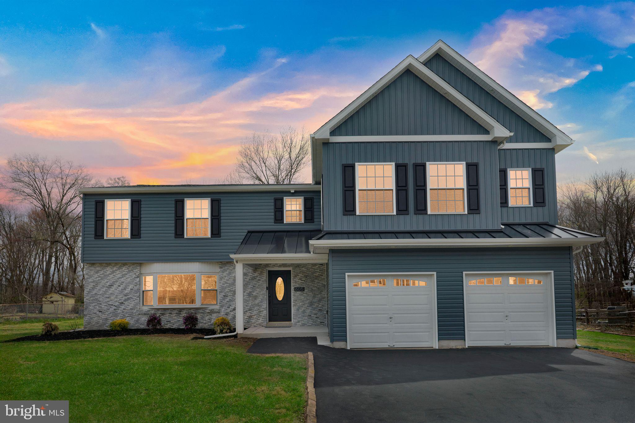 Don't miss this stunning, fully renovated, and expanded home nestled in the desirable Huntingdon Hills neighborhood. Boasting 5 spacious bedrooms and 4 & ½ luxurious bathrooms, this home is the epitome of modern elegance and convenience.
Step into the heart of the home, a brand new gourmet kitchen complete with a large island, abundant cabinetry, and expansive counter space. Enjoy the added touches of under-cabinet lighting, a pantry, and a 4-piece stainless steel appliance package. Adjacent to the kitchen, the family room offers a cozy retreat with an electric fireplace, wet bar, and a convenient powder room.
The formal living room provides a perfect space for entertaining or quiet relaxation. The home also features a spacious 2-car attached garage for your convenience.
The primary bedroom suite is a true sanctuary, featuring two large walk-in closets and a custom-tiled master bathroom. Indulge in the luxury of a 9’ long two-person shower with granite bench seat and a twin sink vanity adorned with granite countertops.
Two of the remaining 4 bedrooms, have their own private full bathrooms. One of these suites is located in the finished basement, the other is on the 2nd floor. Both are perfect for guests or a private suite. The last two upstairs bedrooms  are on the 2nd floor, have walk-in closets, and share a common bathroom. Also on the second floor is a large laundry room equipped with ample space for folding and cabinets for storage.
The home is situated on a nearly ½ acre lot that offers direct access to the Newtown Rail Trail, perfect for those who enjoy walking, running, or biking.
Experience luxurious living in this beautifully renovated home that combines modern amenities with timeless charm. Schedule your viewing today and make this dream home yours!
Listing Agents have a financial interest in the property.  Taxes have not been reassessed yet since the addition and may increase some. Photos with furniture and green grass have been virtually staged.
